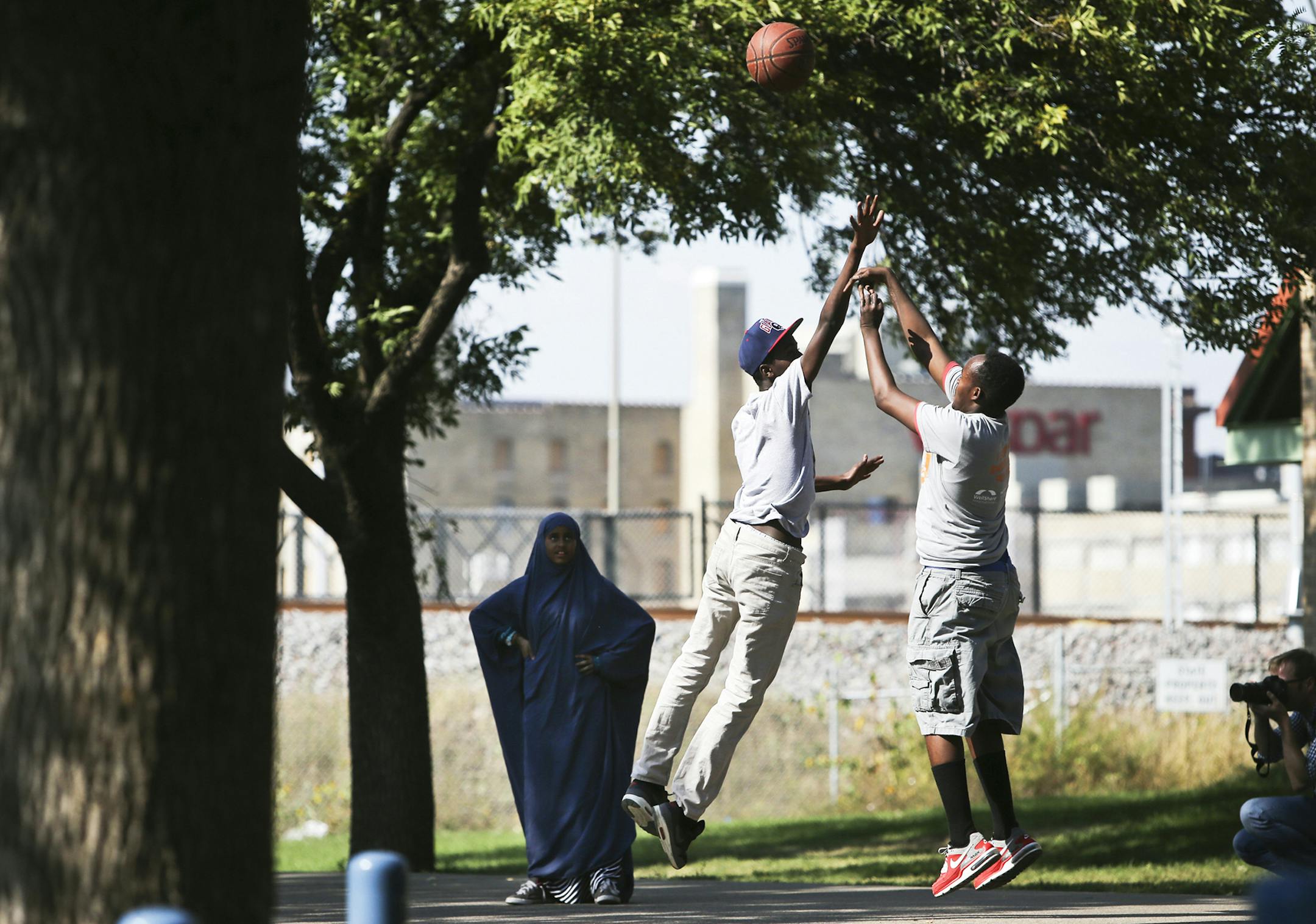 During the rally, some young Somali-Americans played basketball Friday, Sept. 27, 2013, outside the Brian Coyle Community Center in Minneapolis, MN, in the largely Somali American neighborhood. A rally was held to condemn Al-Shabab's attack on Westgate shopping mall in Nairobi, Kenya recently.](DAVID JOLES/STARTRIBUNE) djoles@startribune.com A rally was held Friday, Sept. 27, 2013, outside the Brian Coyle Community Center in Minneapolis, MN, in the largely Somali American neighborhood, to condem