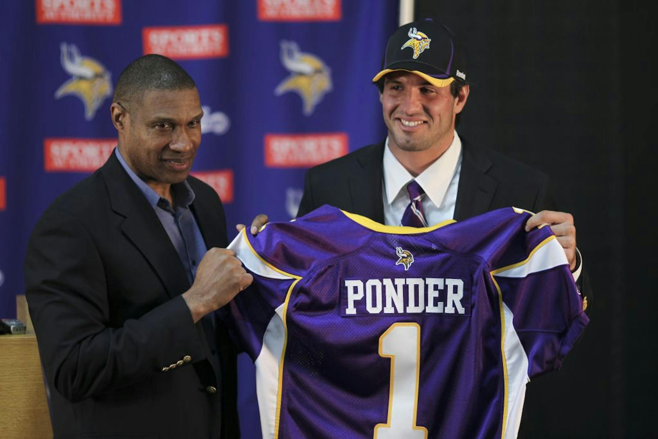 Vikings head coach Leslie Frazier and the team's first round draft choice, Christian Ponder, the Florida State quarterback, posed with a team jersey at the start of a news conference where Ponder was introduced to the news media Friday afternoon.