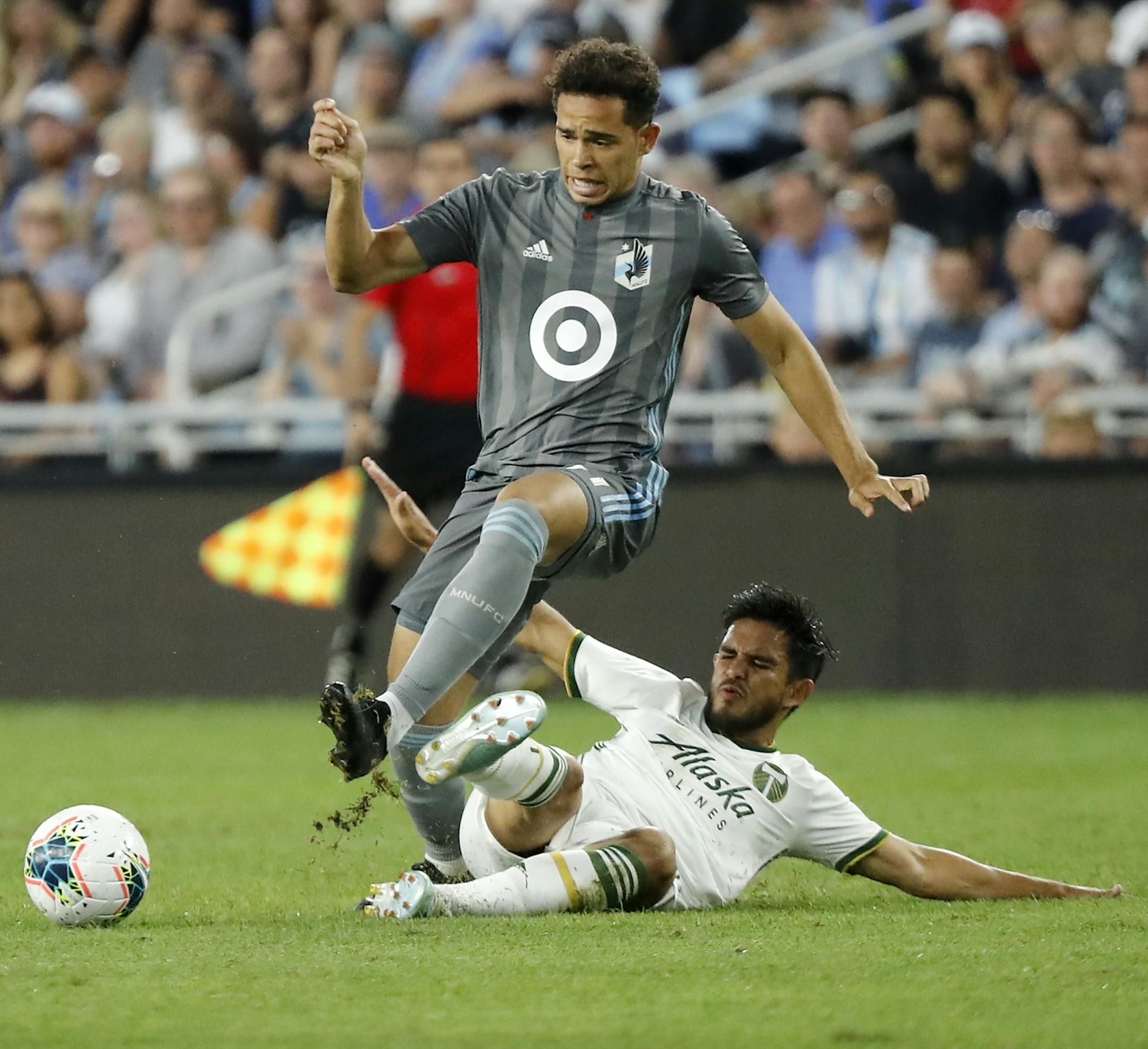 Minnesota United midfielder Hassani Dotson (31) was tripped up by Portland Timbers midfielder Andres Flores (14) during the second half.