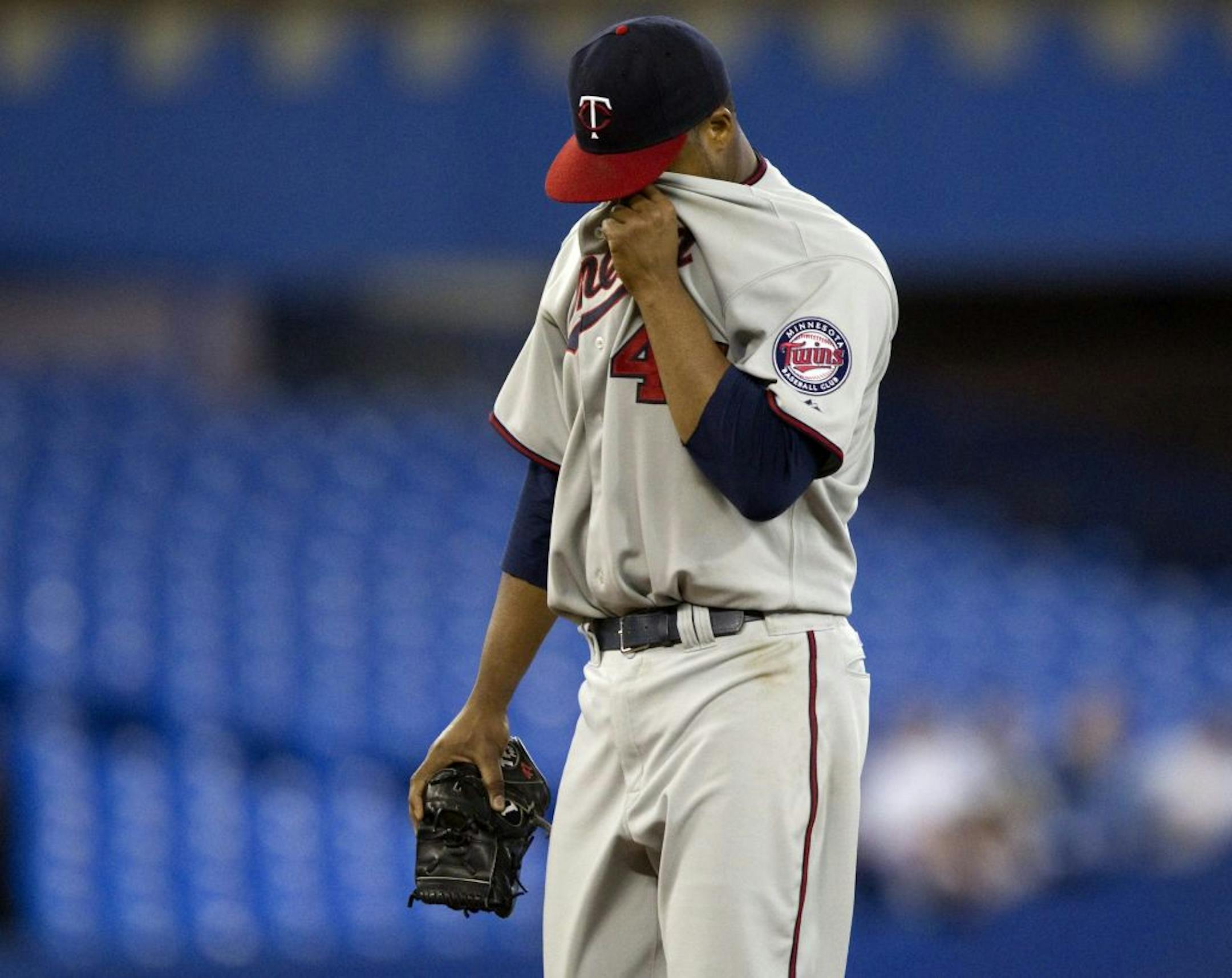 Minnesota Twins starting pitcher Francisco Liriano reacts as he is pulled from the game during fifth inning baseball action against the Toronto Blue Jays in Toronto on Saturday, April 2, 2011.