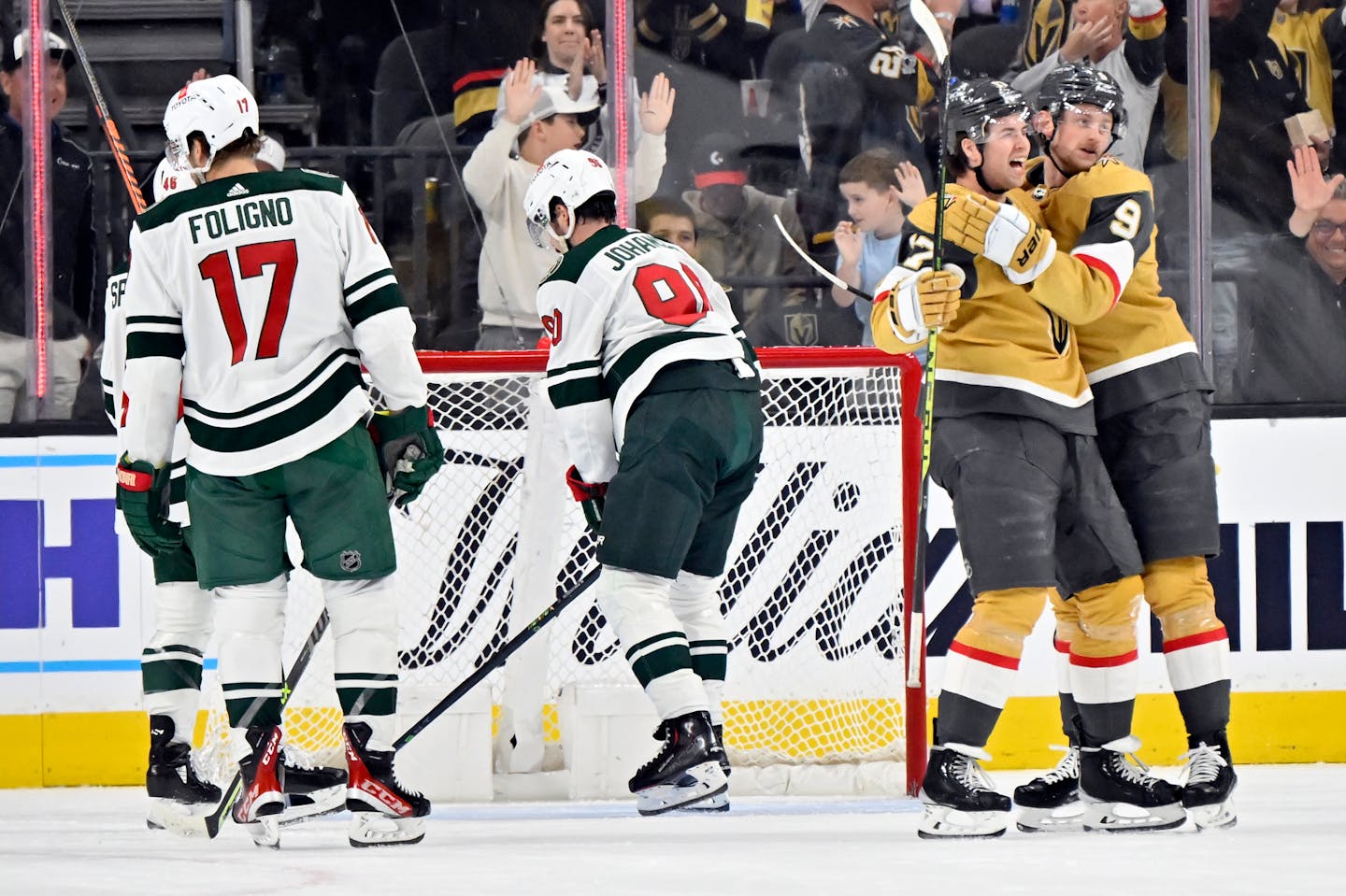 Vegas Golden Knights defenseman Ben Hutton (17) and center Jack Eichel (9) celebrate after a goal against the Minnesota Wild during the first period of an NHL hockey game Saturday, April 1, 2023, in Las Vegas. (AP Photo/David Becker)