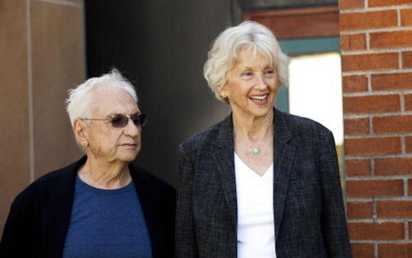 World renowned architect Frank Gehry spends some time with Penny Winton before the dedication of the Gehry-designed Winton Guest House at the Gainey Conference Center in Owatonna, Minn., on Sunday October 2, 2011. The home was donated to the University of St. Thomas and moved from its original site in Orono on Lake Minnetonka. (Thomas Whisenand/University of St. Thomas).