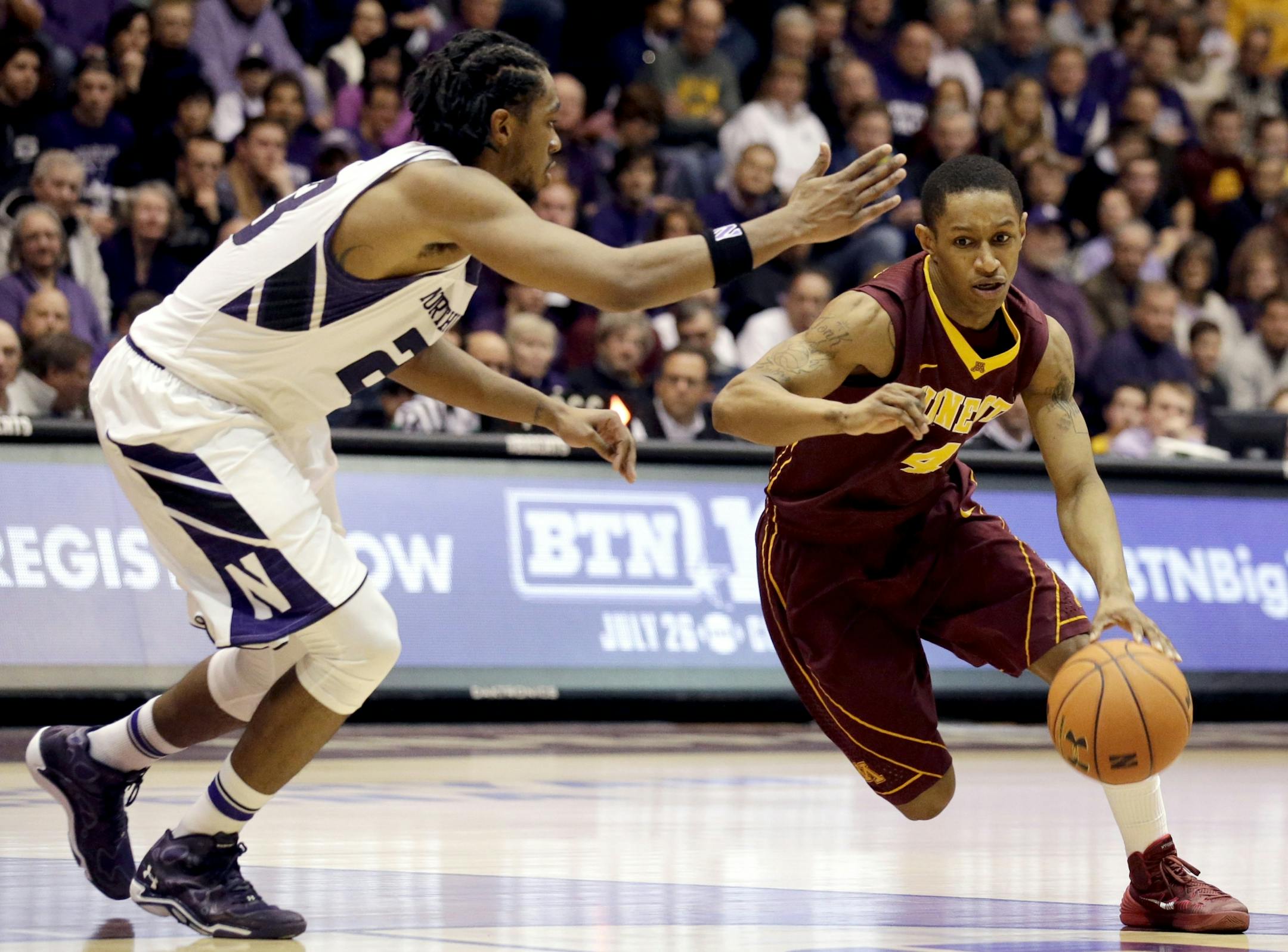 Gophers point guard DeAndre Mathieu drove against Northwestern guard JerShon Cobb.