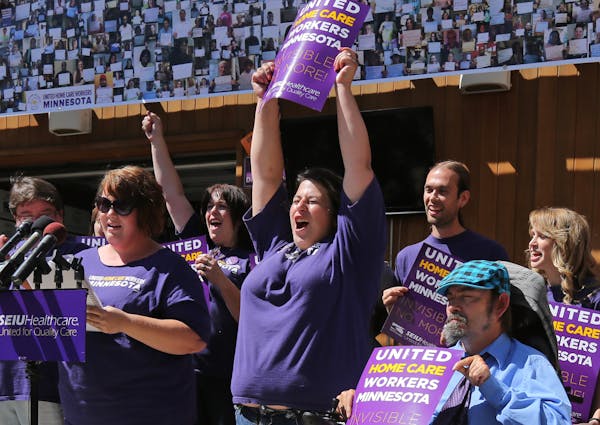 In August, home care workers, including Sumer Spika (at podium.) announced that in-home health care providers in Minnesota had voted to unionize.