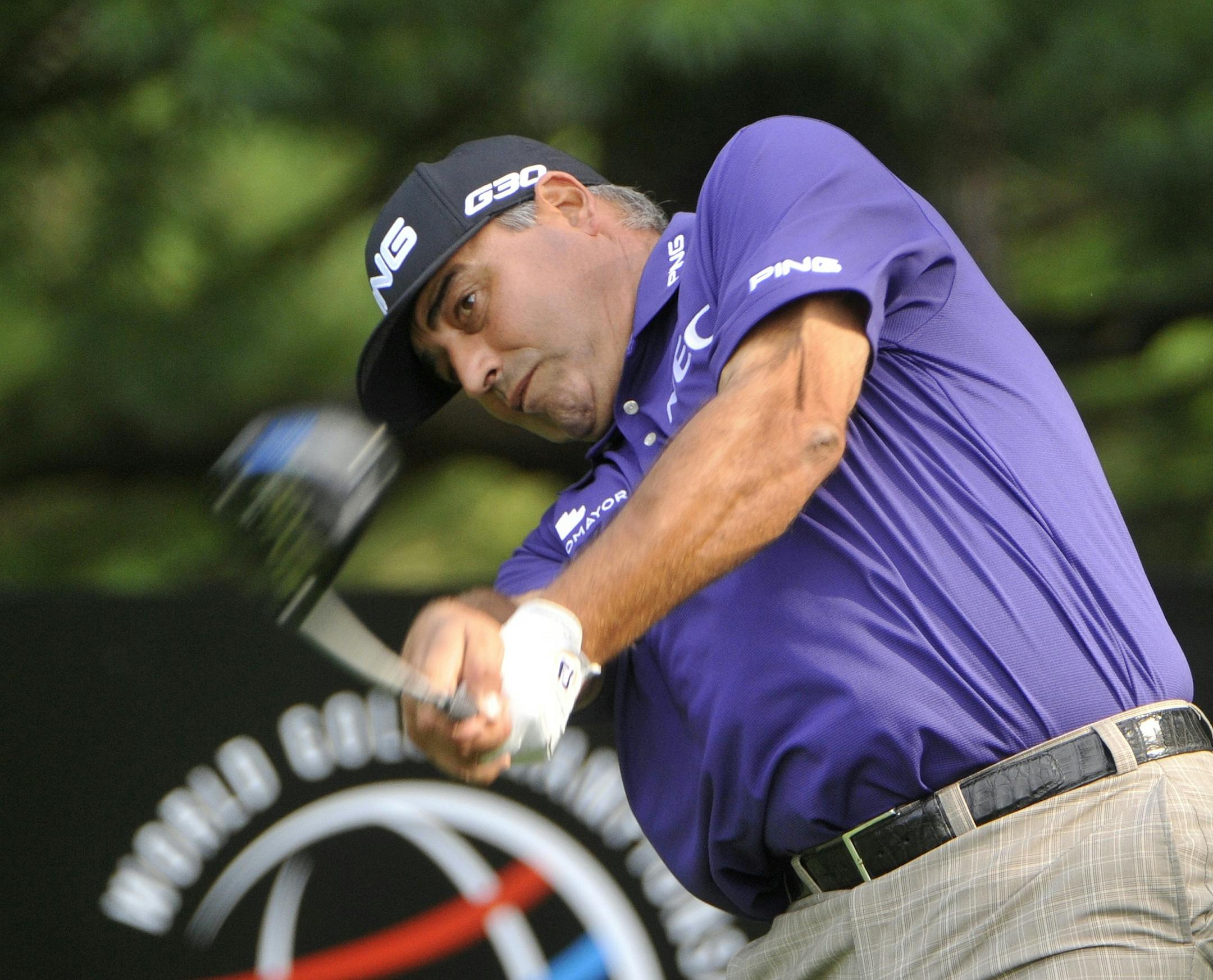 Angel Cabrera of Argentina, hits his tee shot at the second hole, during the first round of the Bridgestone Invitational golf tournament, Thursday, July 31, 2014, in Akron, Ohio. (AP Photo/Phil Long)