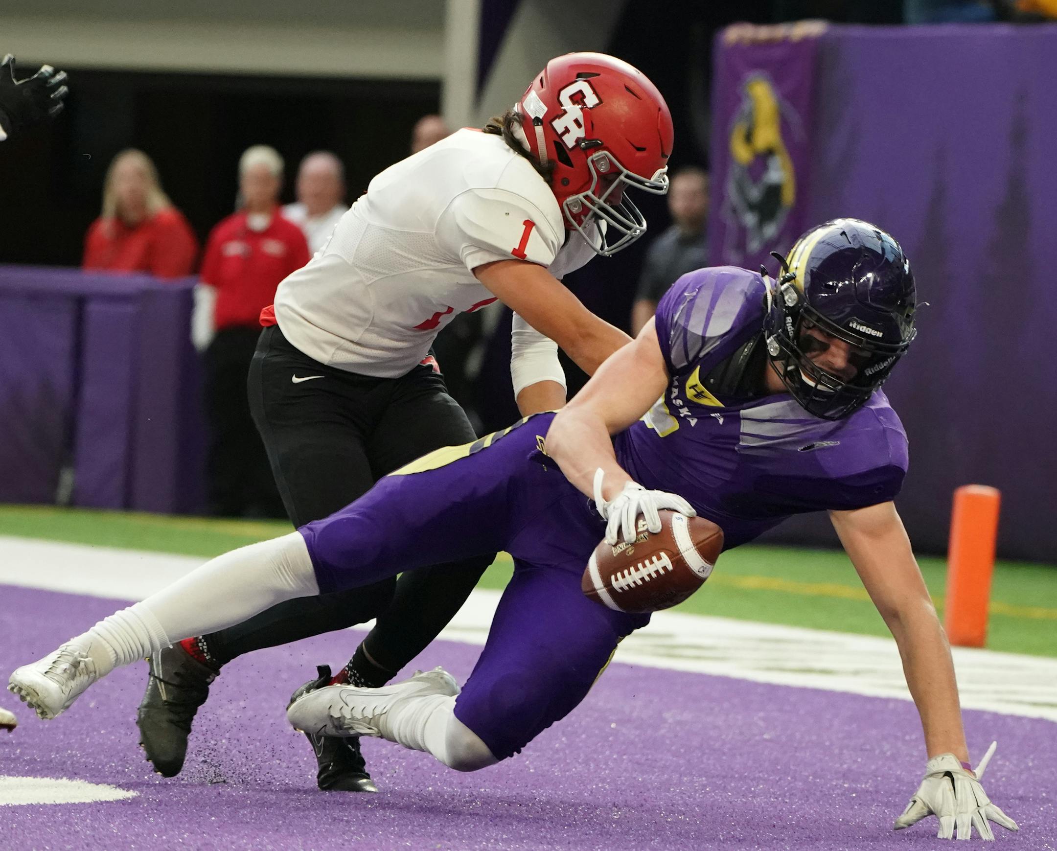 Chaska linebacker Stevo Klotz (above, scoring on a 36-yard touchdown run vs. Coon Rapids) doubles as a running back for the physical Hawks.
