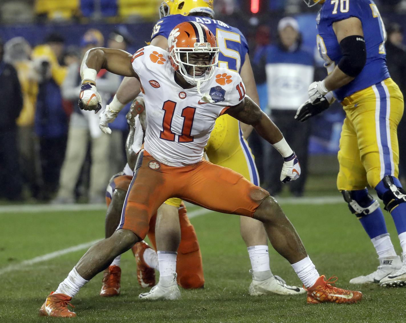 FILE - In this Dec. 1, 2018, file photo, Clemson's Isaiah Simmons (11) reacts after making a play against Pittsburgh in the first half of the Atlantic Coast Conference championship NCAA college football game in Charlotte, N.C. Simmons is a likely first-round pick in the NFL draft Thursday, April 23, 2020. (AP Photo/Chuck Burton, File)