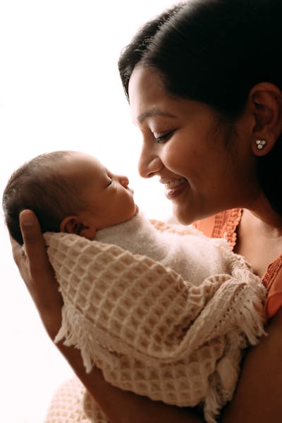 This spring, Radhika nuzzled up next to her newborn son a few weeks after his birth. “Radhika was thrilled to be a mom,” her husband says.