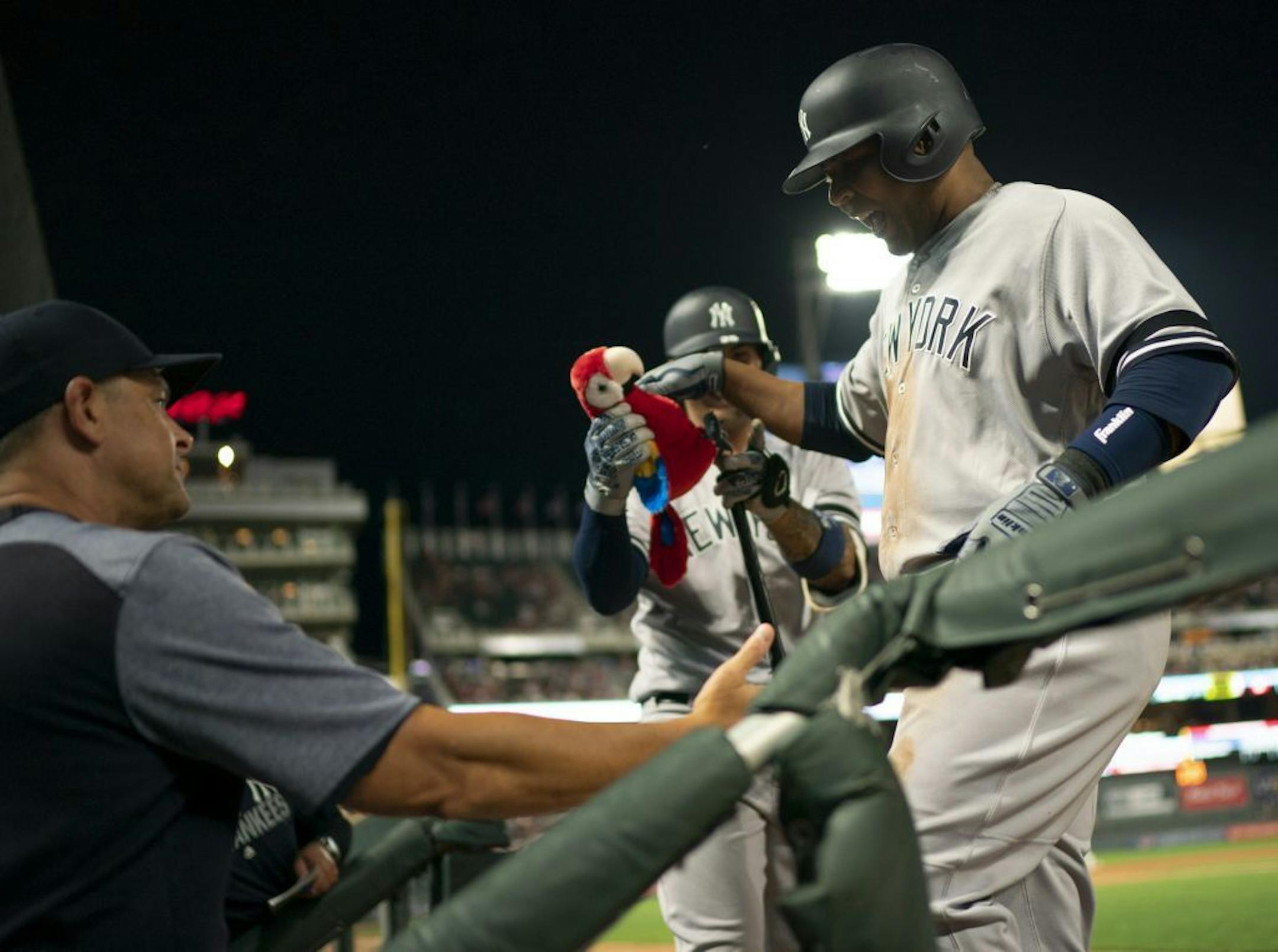 A teammate handed New York Yankees designated hitter Edwin Encarnacion a stuffed parrot after he knocked a Devin Smeltzer pitch for a solo homer to left in the ninth inning.