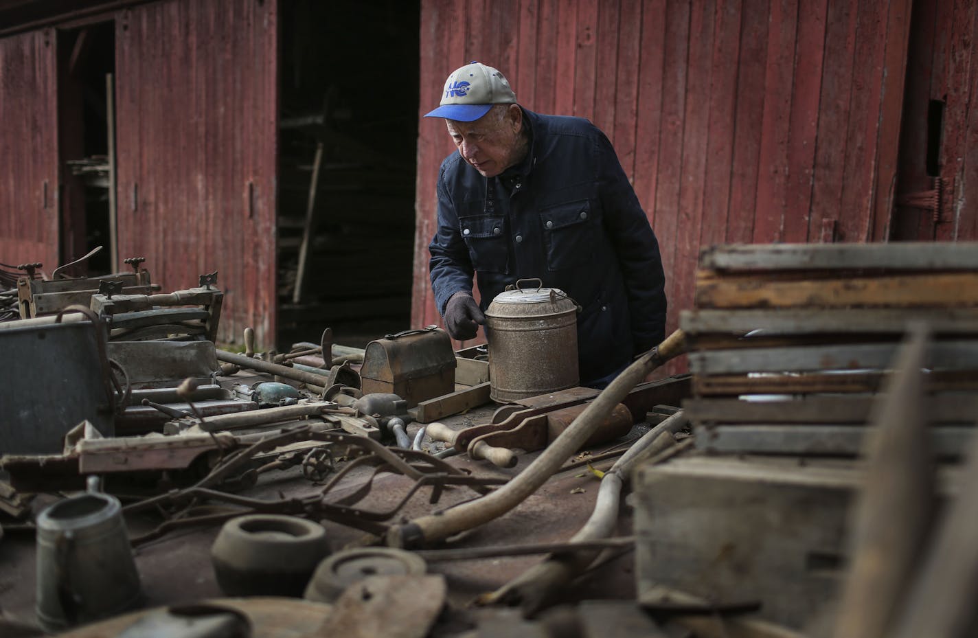 Wayne Schilling, a fifth-generation farmer in Woodbury, and his wife, Betty, auctioned off all their farm equipment and machinery Saturday, Oct. 4, 2014, in Woodbury, MN. Here, Allan Sickmeier of Woodbury looks over items to be auctioned off.](DAVID JOLES/STARTRIBUNE)djoles@startribune.com Wayne Schilling, a fifth-generation farmer in Woodbury, has sold the last 130 acres of the family farm and one of the last farms in Woodbury to developers. Wayne and his wife, Betty, auctioned off all their fa