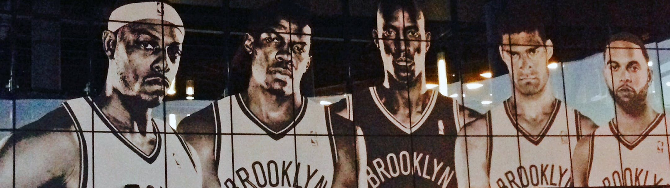 Entrance to Barclays center (will be my lede) and kind of jarring to see Kevin Garnett -KG - in Brooklyn uniform