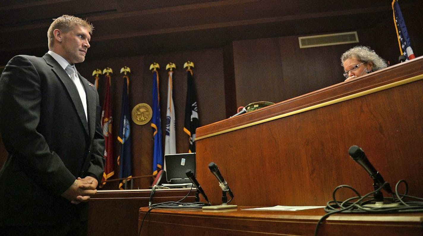 Chris Hvinden looked over to Judge Judith Tilsen while being recognized for his accomplishments in Ramsey County District Court during the the veterans graduation ceremony in 2015. Veterans groups want to expand the program statewide.