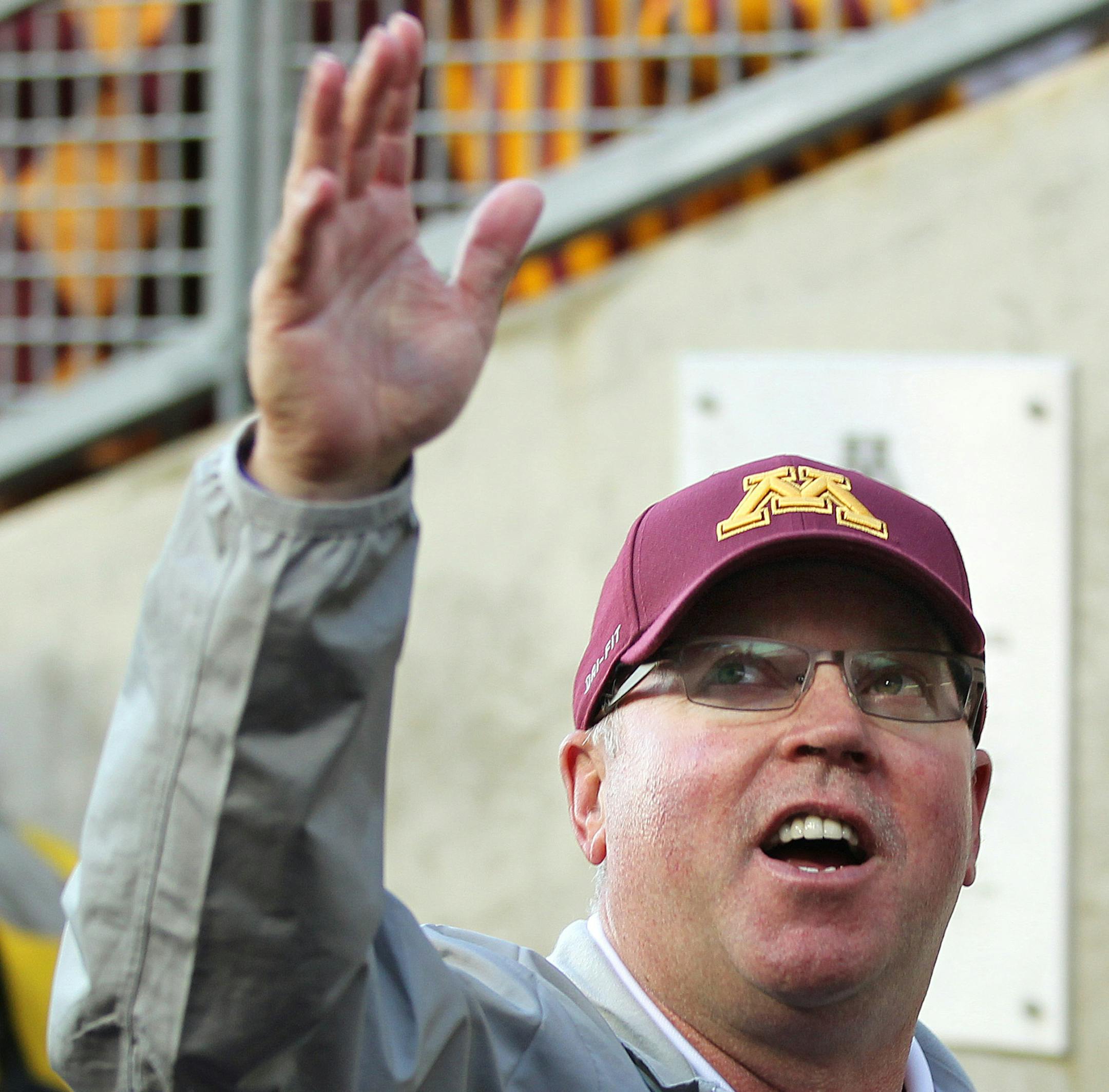 Minnesota head coach Jerry Kill waves to the student section as he leaves the field after Minnesota defeated San Jose State in their NCAA football game on Saturday, Sept. 20, 2014 in Minneapolis. (AP Photo/Andy Clayton-King) ORG XMIT: MNAK118