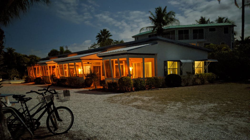 Classic cottages at Tropical Winds Beachfront Motel were illuminated by a full moon on Sanibel Island, Fla.