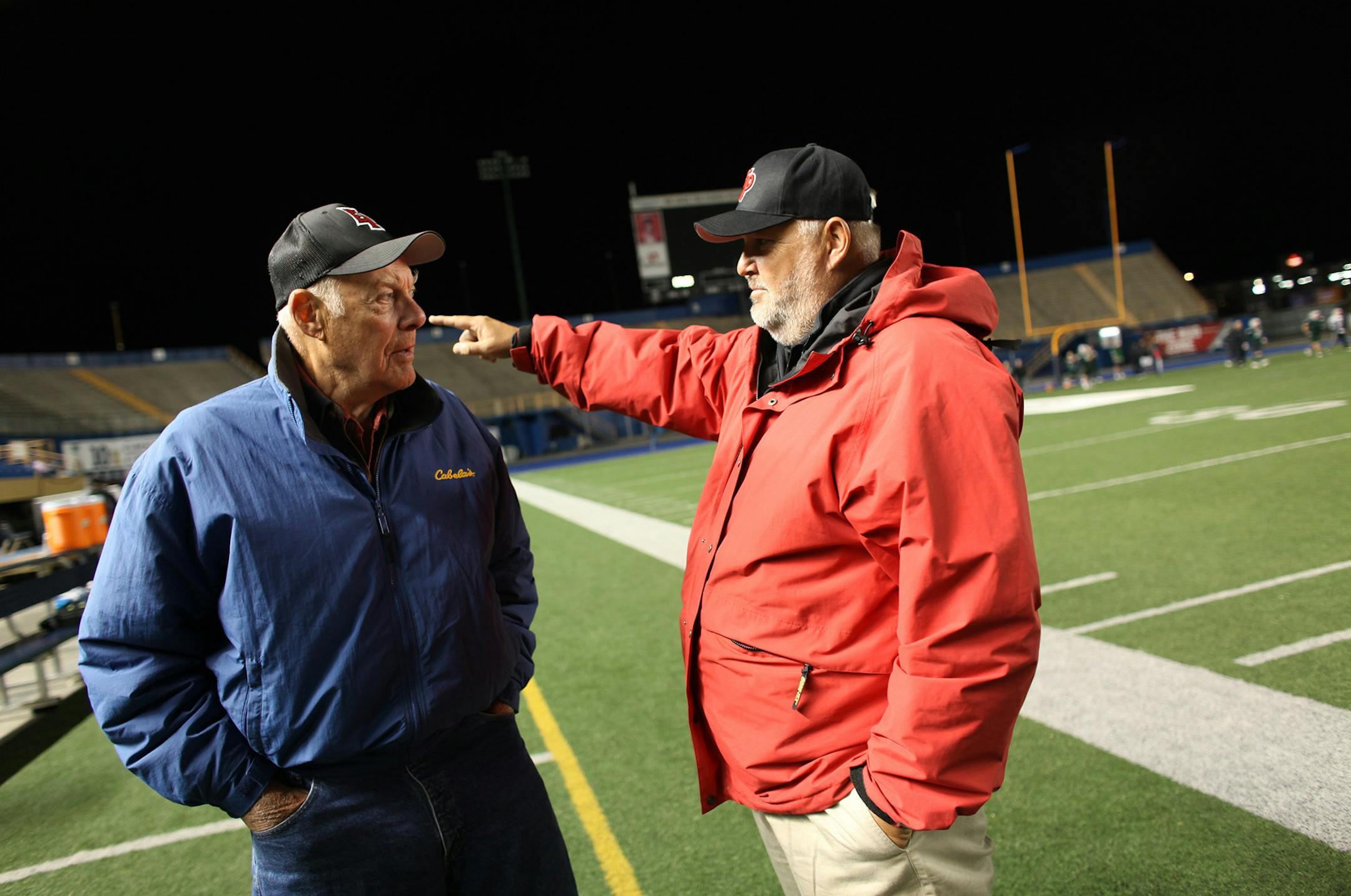 Bud Grant and his son Mike Grant, head coach at Eden Prairie, joked around on the sidelines during Eden Prairie's practice on the home turf of the Canadian Blue Bombers in September, 2010.