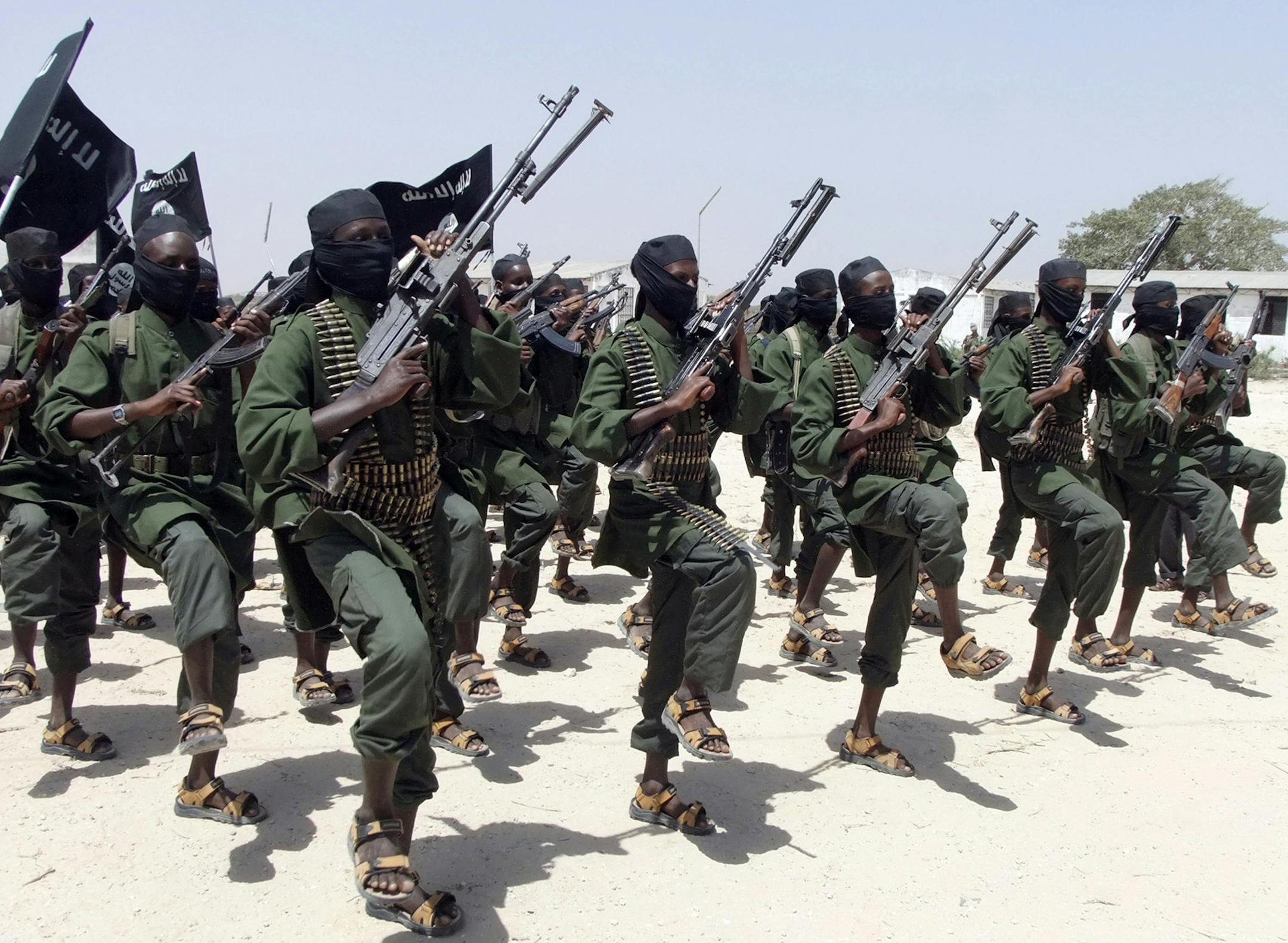FILE - In this Thursday, Feb. 17, 2011 file photo, hundreds of newly trained al-Shabab fighters perform military exercises in the Lafofe area some 18 km south of Mogadishu, in Somalia. A Somali military official said Tuesday, Sept 1, 2015 that al-Shabab Islamic extremists have attacked an African Union (AU) base in the small farming town of Janale in southern Somalia. (AP Photo/Farah Abdi Warsameh, File)