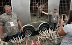 Steve Porter, left, and his son, Dillan, displayed a trophy deer, named Heart Attack, top, at Wisconsin Game Fest in September.