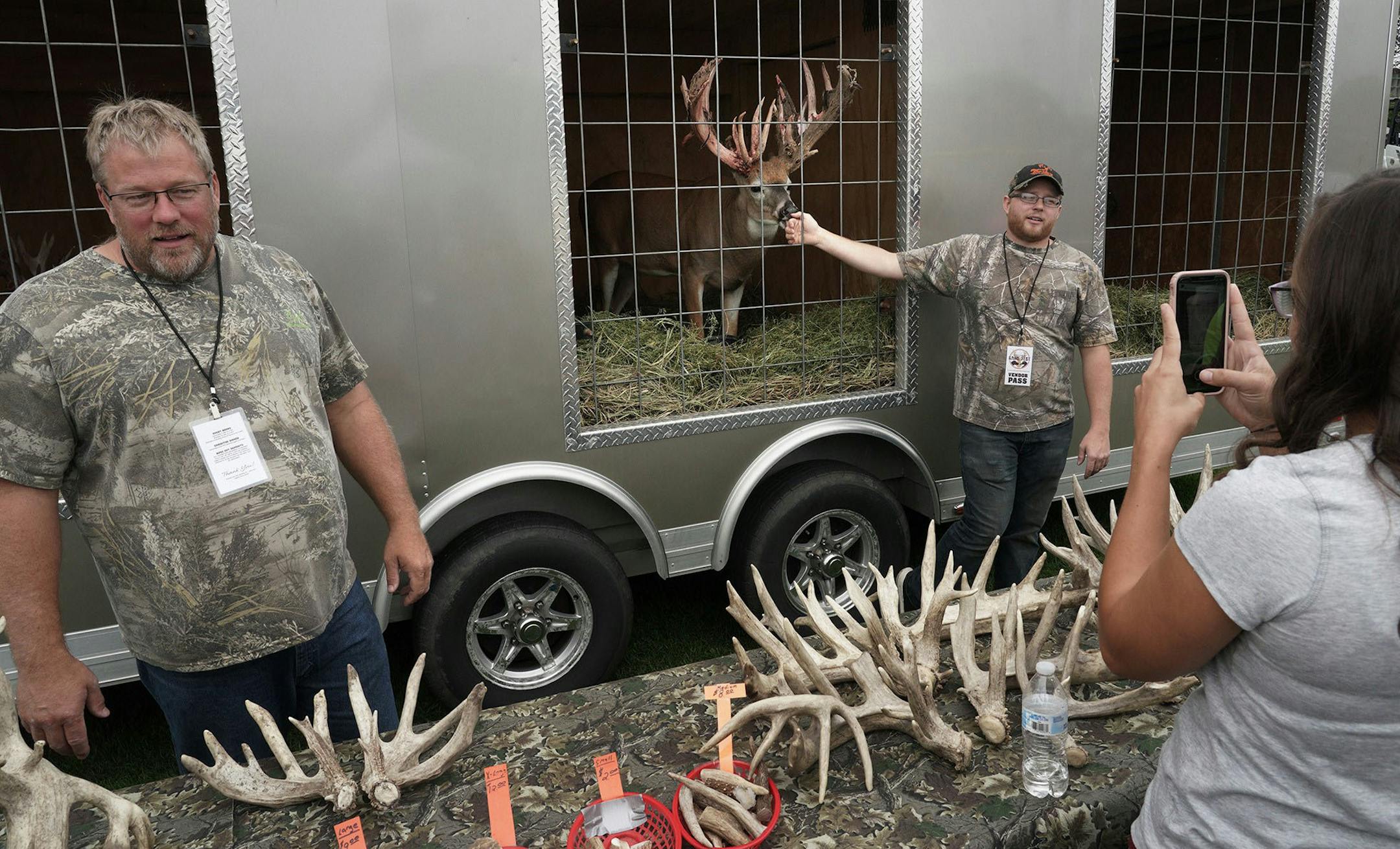 Steve Porter, left, and his son, Dillan, displayed a trophy deer, named Heart Attack, top, at Wisconsin Game Fest in September.