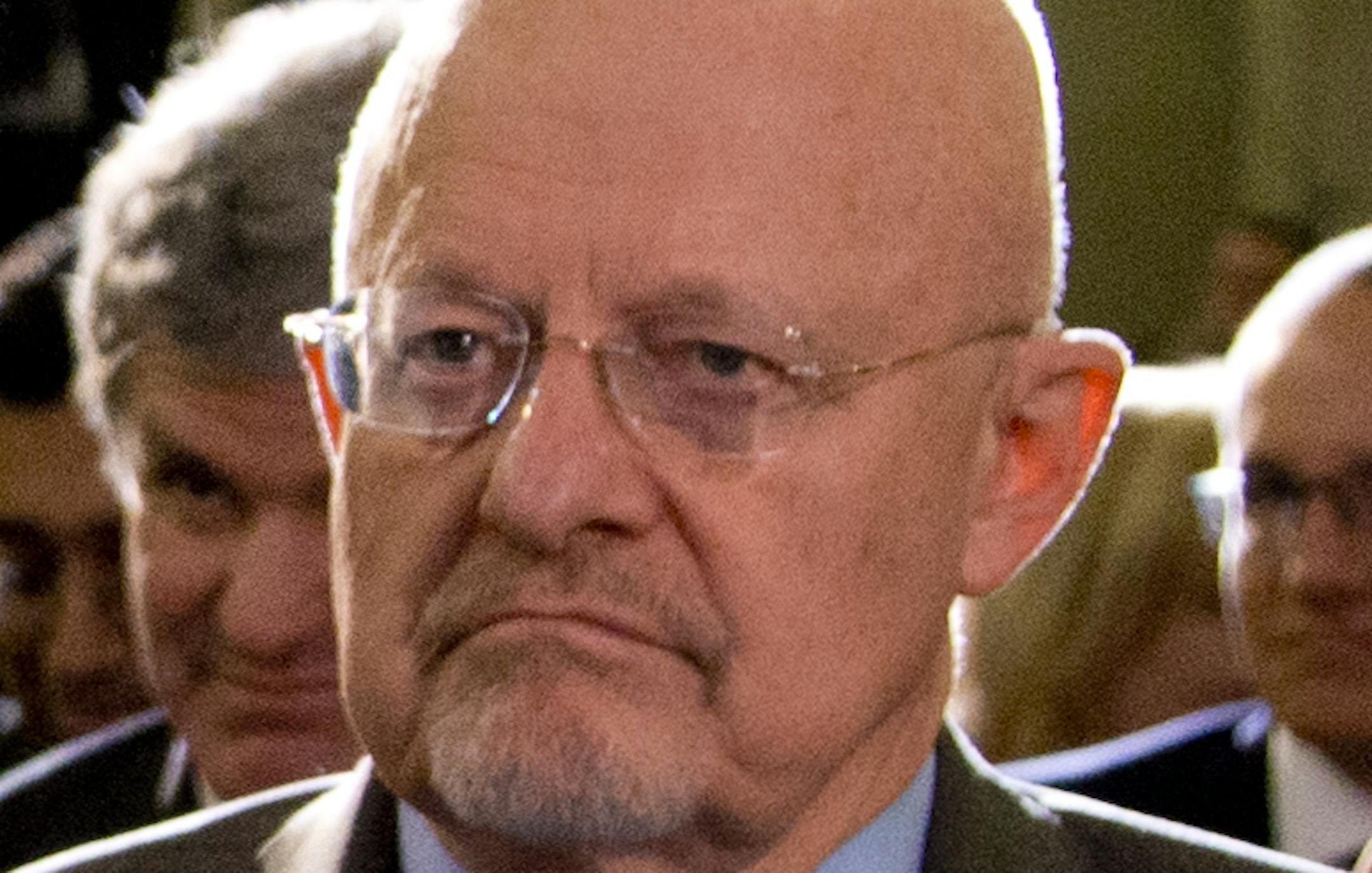 Director of National Intelligence James Clapper, right, and CIA Director John Brennan, left, sit in the front row before President Barack Obama talks about National Security Agency (NSA) surveillance, Friday, Jan. 17, 2014, at the Justice Department in Washington. The president called for ending the government's control of phone data from millions of Americans. (AP Photo/Carolyn Kaster)