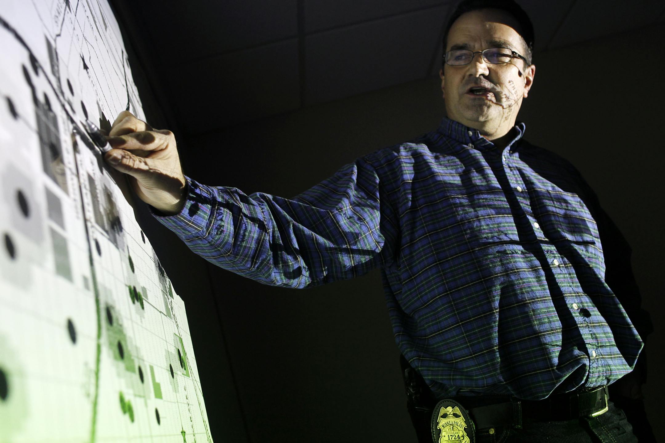 Richard Tsong-Taatarii/rtsong-taatarii@startribune.com Minneapolisl, MN;01/04/11;left to right ] Sgt. Jeff Egge runs the Crime Analysis Unit. Using crime data and software, his team is able to point out hotspots where crime is likely to occur.