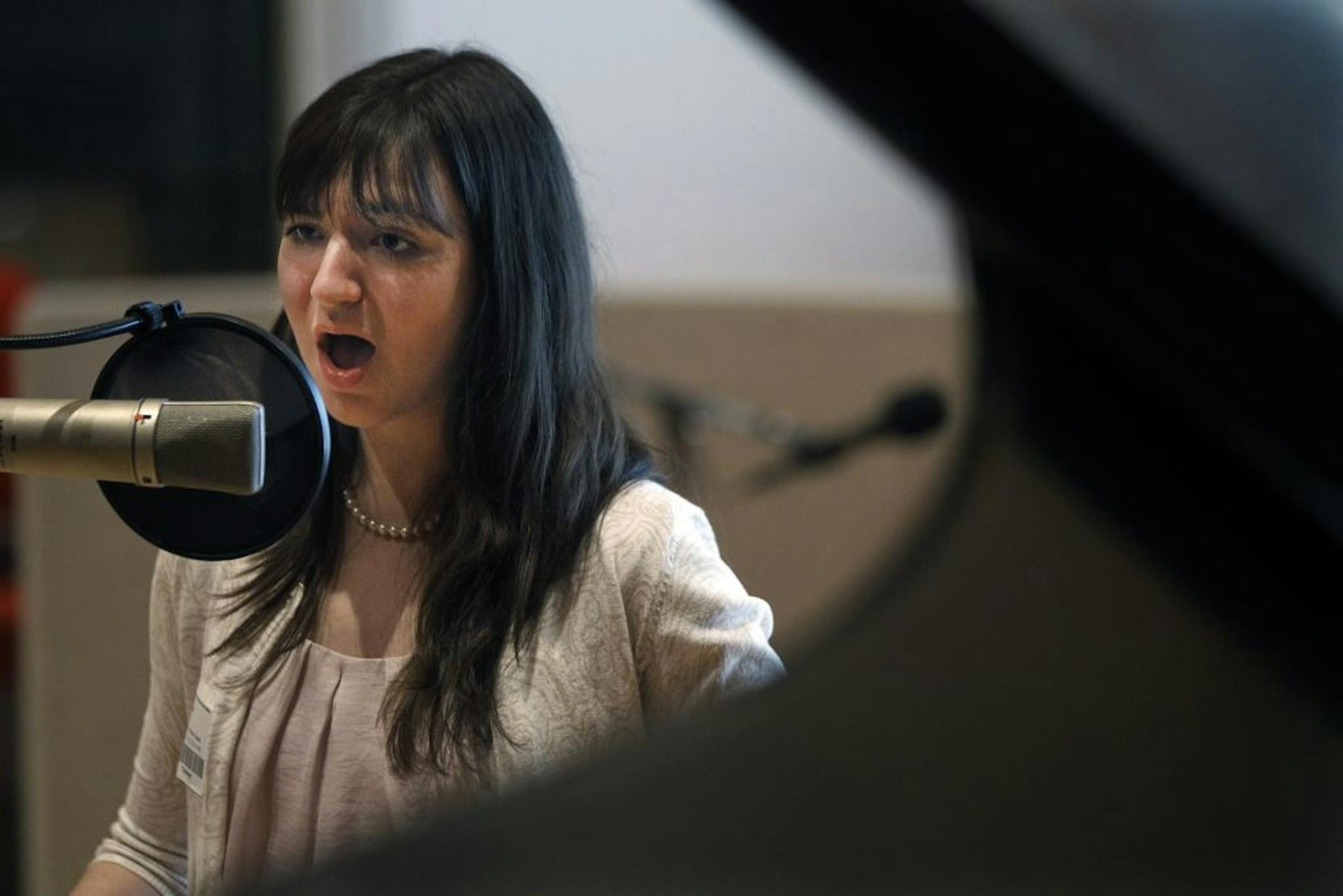 At Studio M at MPR, vocalist Briana Moynihan rehearsed before her recording .