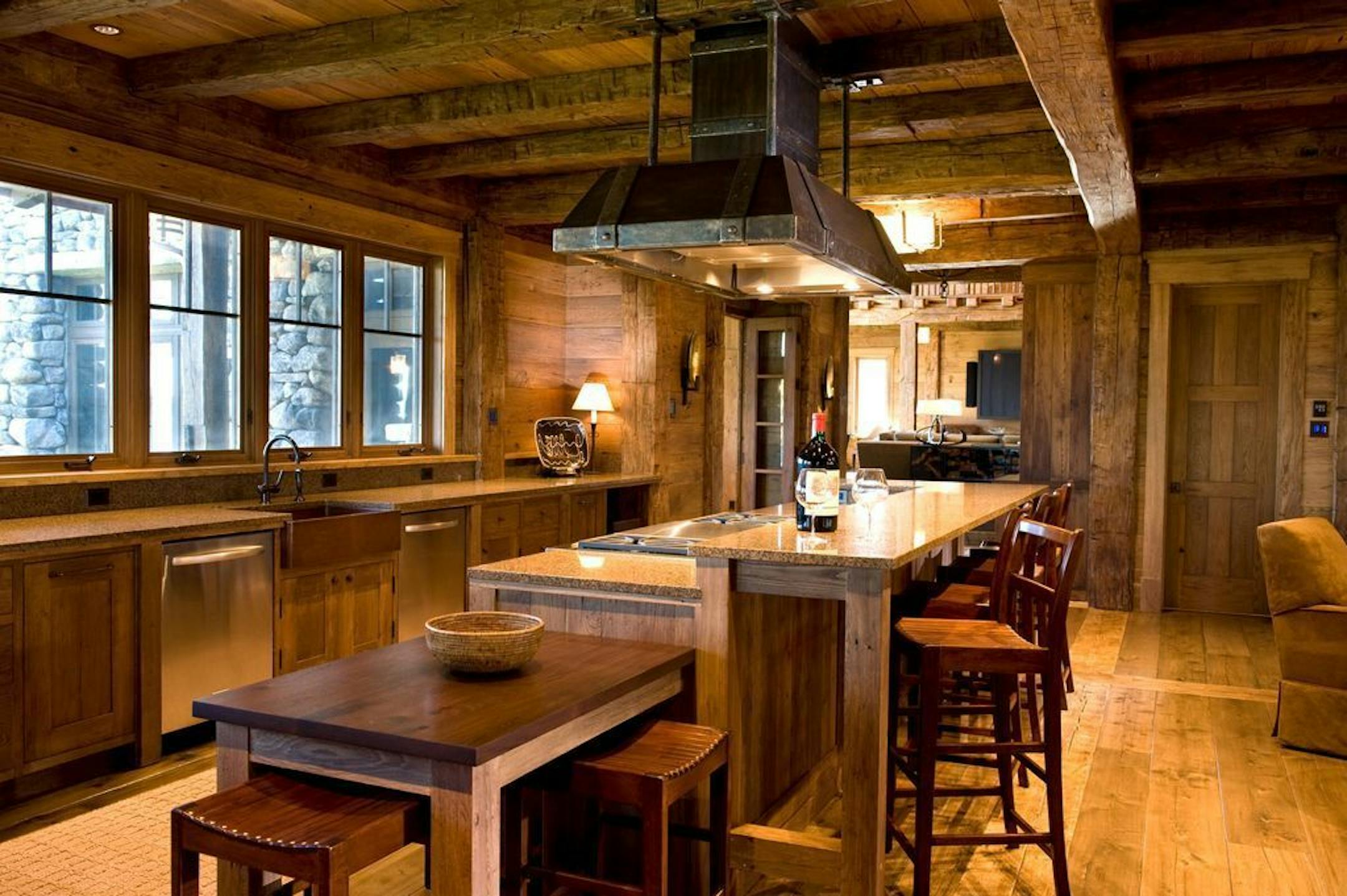 The kitchen has windows rather than upper cabinets. There's a walk-in pantry for extra storage.