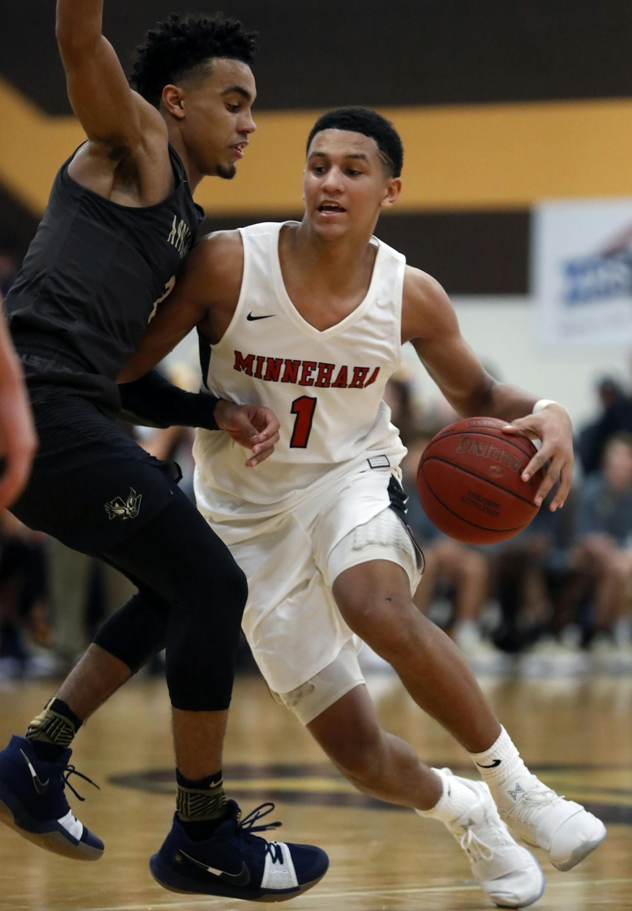 Jalen Suggs(1) drives on Tre Jones(3) of Apple Valley.