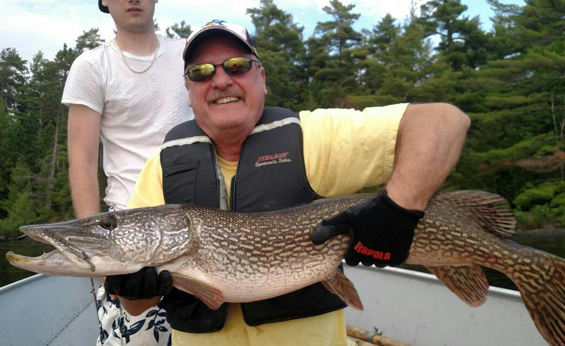 BIG NORTHERN: Jim Miller of Champlin caught this northern while trolling on Rainy Lake.”I knew it was a nice fish right away,’’ he said. “My son, Jake, used a small net and his hands, and my wife, Ruth, grabbed the tail to boat the fish. We let it go, to grow some more and to catch it again.”