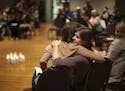 At the end of the program, organizer Sarah Super, left, was hugged by Kaitlyn, one of a dozen women who shared their experiences at the "Break the Sil