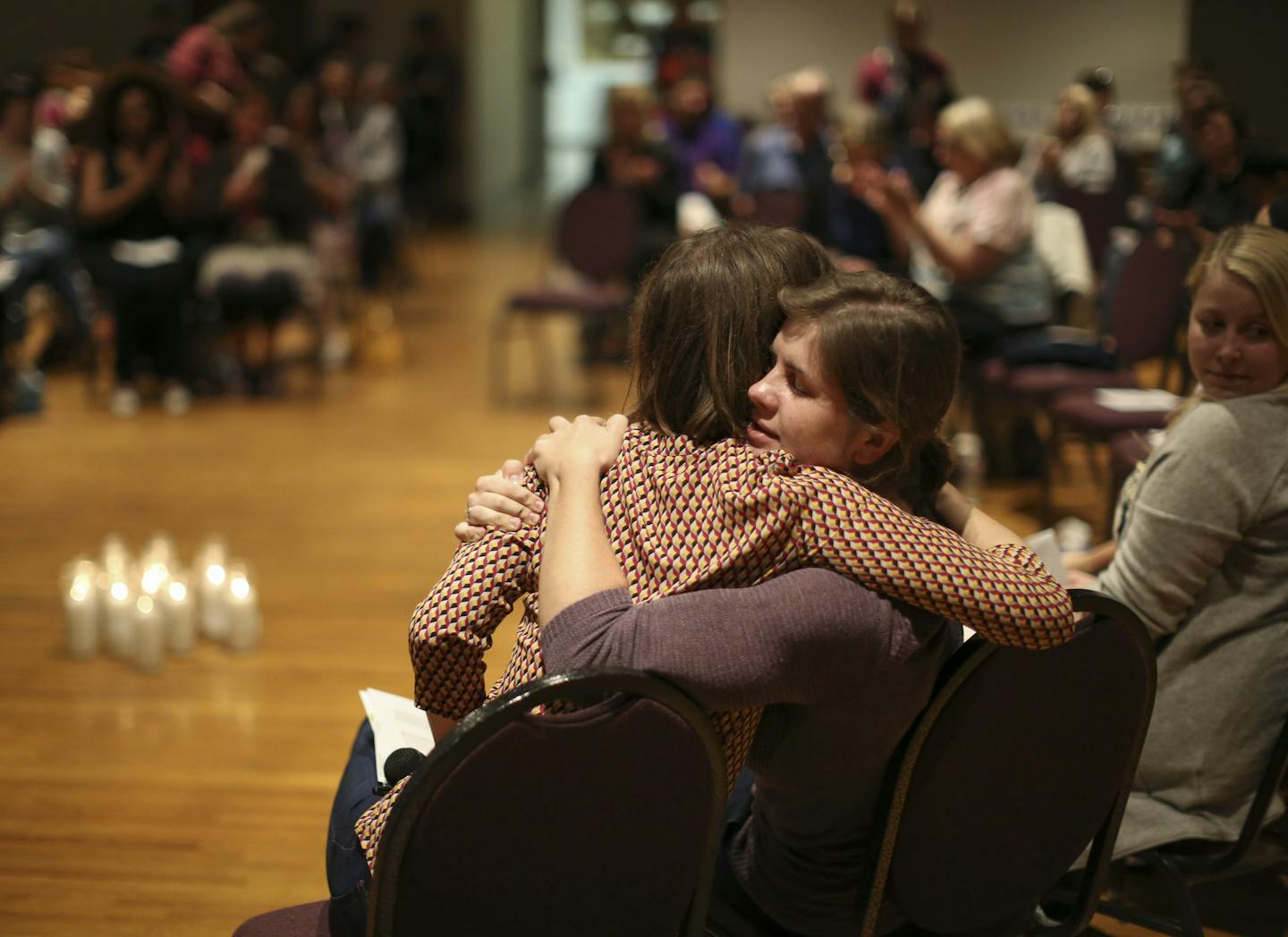 At the end of the program, organizer Sarah Super, left, was hugged by Kaitlyn, one of a dozen women who shared their experiences at the "Break the Silence Day" gathering Tuesday night in Minneapolis. ] JEFF WHEELER &#xef; jeff.wheeler@startribune.com Survivors of sexual violence gathered at the Ukrainian Event Center in Minneapolis Tuesday night, August 18, 2015 to speak up and out about sexual violence for "Break the Silence Day," organized by Sarah Super, a woman who was raped by an ex-boyfrie