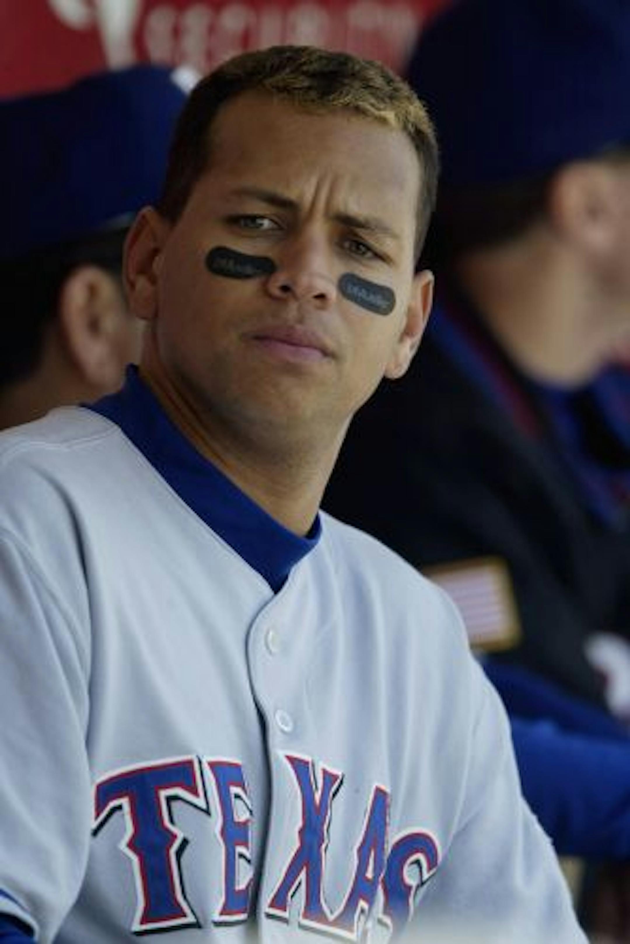 OAKLAND, CA - JUNE 19: Shortstop Alex Rodriguez #3 of the Texas Rangers sits in the dugout during the American League game against the Oakland Athletics at the Network Associates Coliseum on June 19, 2003 in Oakland, California. The Athletics defeated the Rangers 9-2.