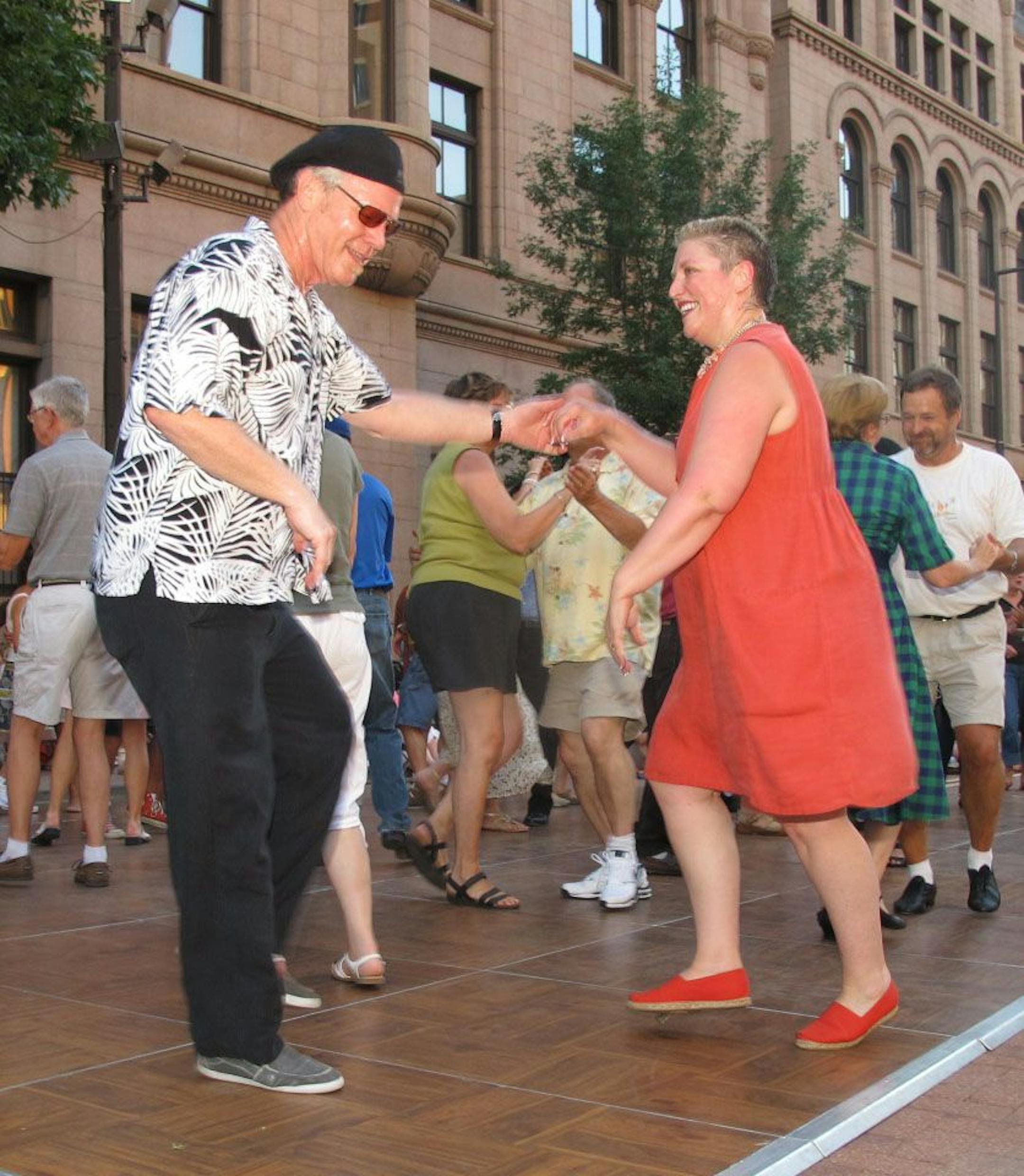 John Ryan and Nancy Norling take advantage of The Ordway's Summer Dance Series, which offered free dancing and live music in Landmark Plaza.