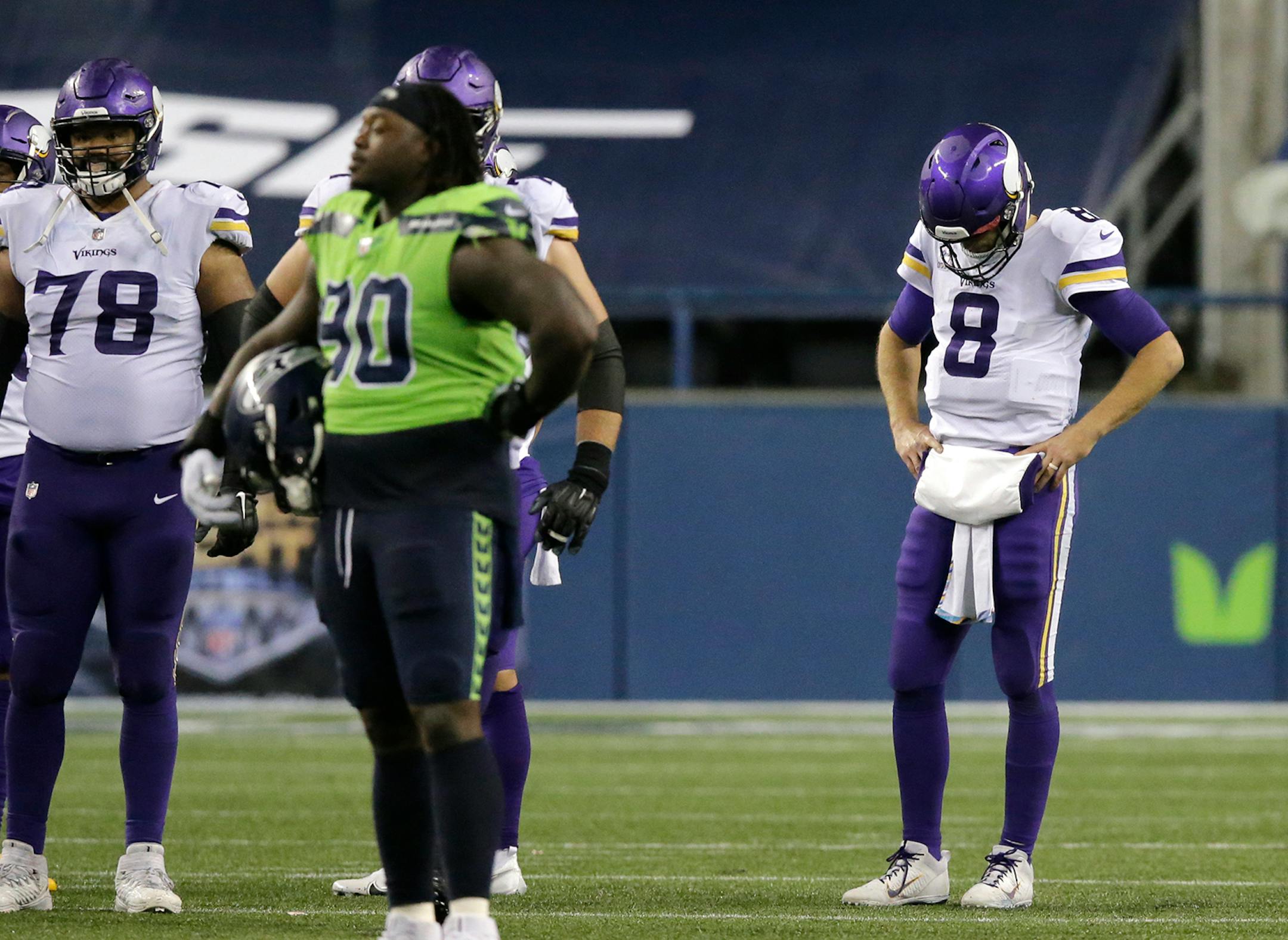 Minnesota Vikings quarterback Kirk Cousins (8) looks down against the Seattle Seahawks as the NFL football game ends, Sunday, Oct. 11, 2020, in Seattle. The Seahawks won 27-26.