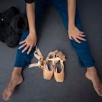 Kanon Kimura waited on stage to put her shoes on while others warmed up for the first performance Sunday afternoon.