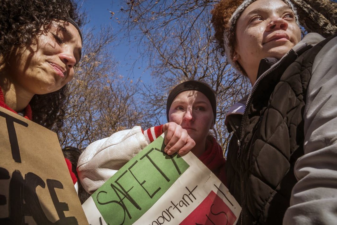 Highland Park Senior High students Majeur Tucker, Sophie Cocchiarella and Kennedy McTeague, became emotional during a moment of silence for victims of high school shootings at the State Capitol on Wednesday, March 7.