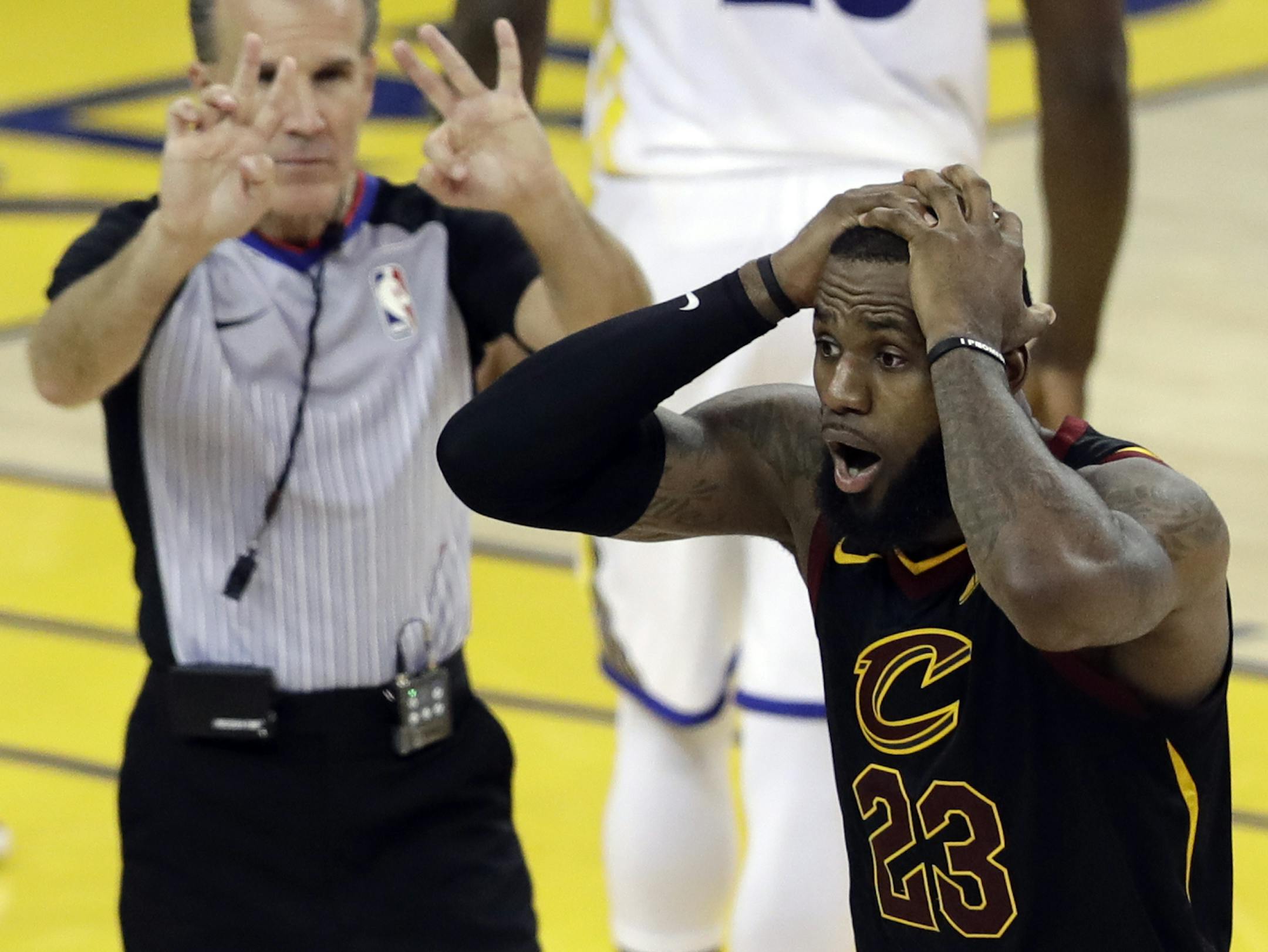 Cleveland Cavaliers forward LeBron James (23) reacts to a call during the second half of Game 1 of basketball's NBA Finals between the Golden State Warriors and the Cavaliers in Oakland, Calif., Thursday, May 31, 2018. (AP Photo/Marcio Jose Sanchez)