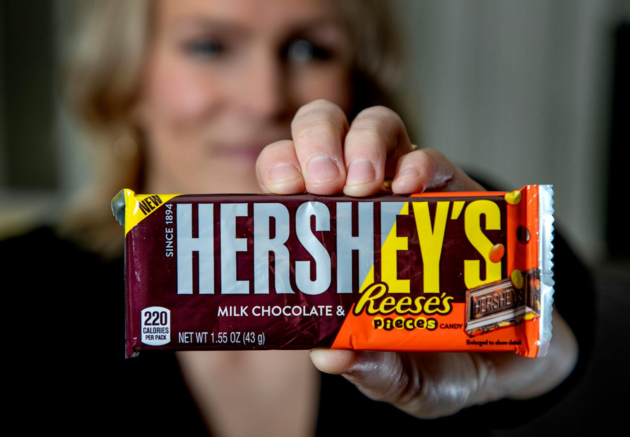 Jenny Ries held up a new candy bar that combines Hershey's and Reese's candies. Engaged St. Paul couple Jenny Ries and Craig Hirschey contacted the Hershey's and Reese's candy companies about the coincidences in their names. ] CARLOS GONZALEZ • cgonzalez@startribune.com – Minneapolis, MN – February 6, 2019, Jenny Ries (pronounced like Reese's peanut butter cups) is marrying Craig Hirschey (yep, like Hershey's chocolate bars) on February 23rd. When they got engaged last spring, Ries contacted Her