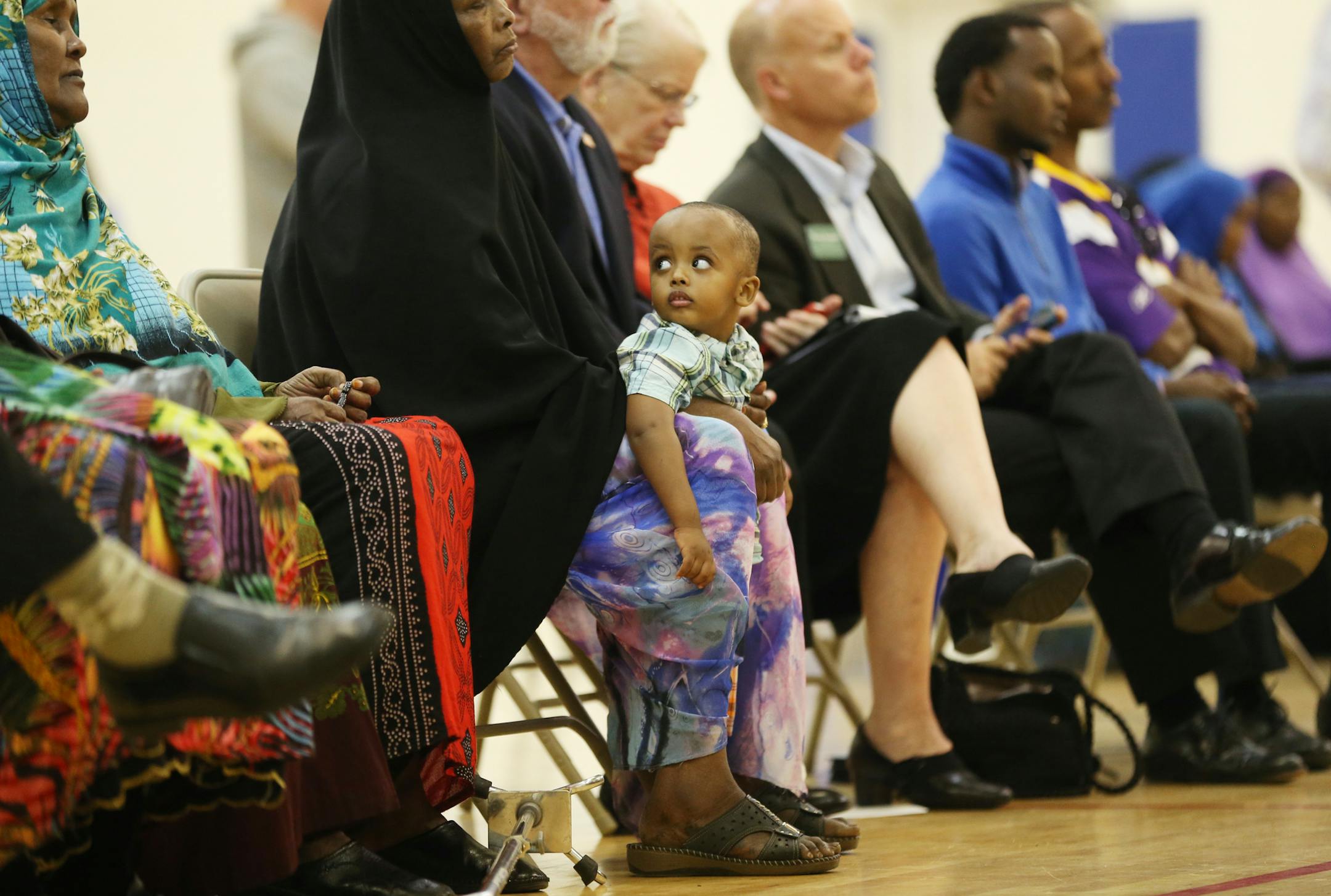 A little boy looked around the hall where dozens of adults gathered to discuss how to stop kids from being recruited by radicals.