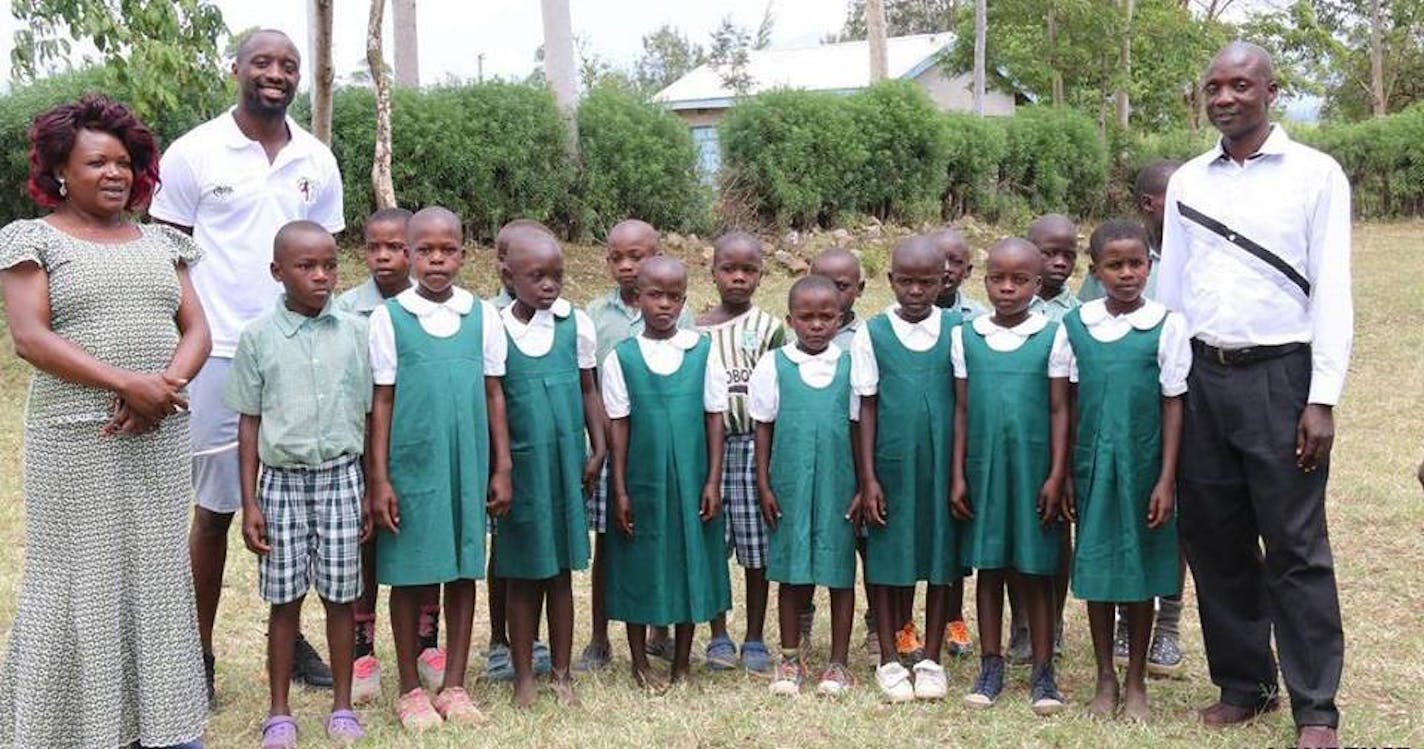 Lawrence Olum, second from left, got the chance of a lifetime when he was spotted playing street soccer by a college coach. Now his foundation uses education and sports to help kids in Kenya.