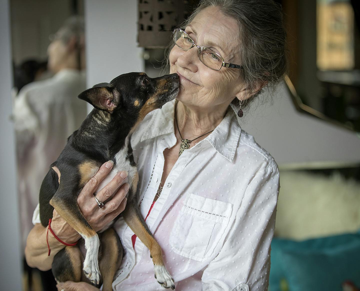 Lucy Francis received loving from her dog "Fred" while she took a break from creating a miniature dog at her home, Monday, August 6, 2018 in Hastings, MN. ] ELIZABETH FLORES &#xef; liz.flores@startribune.com