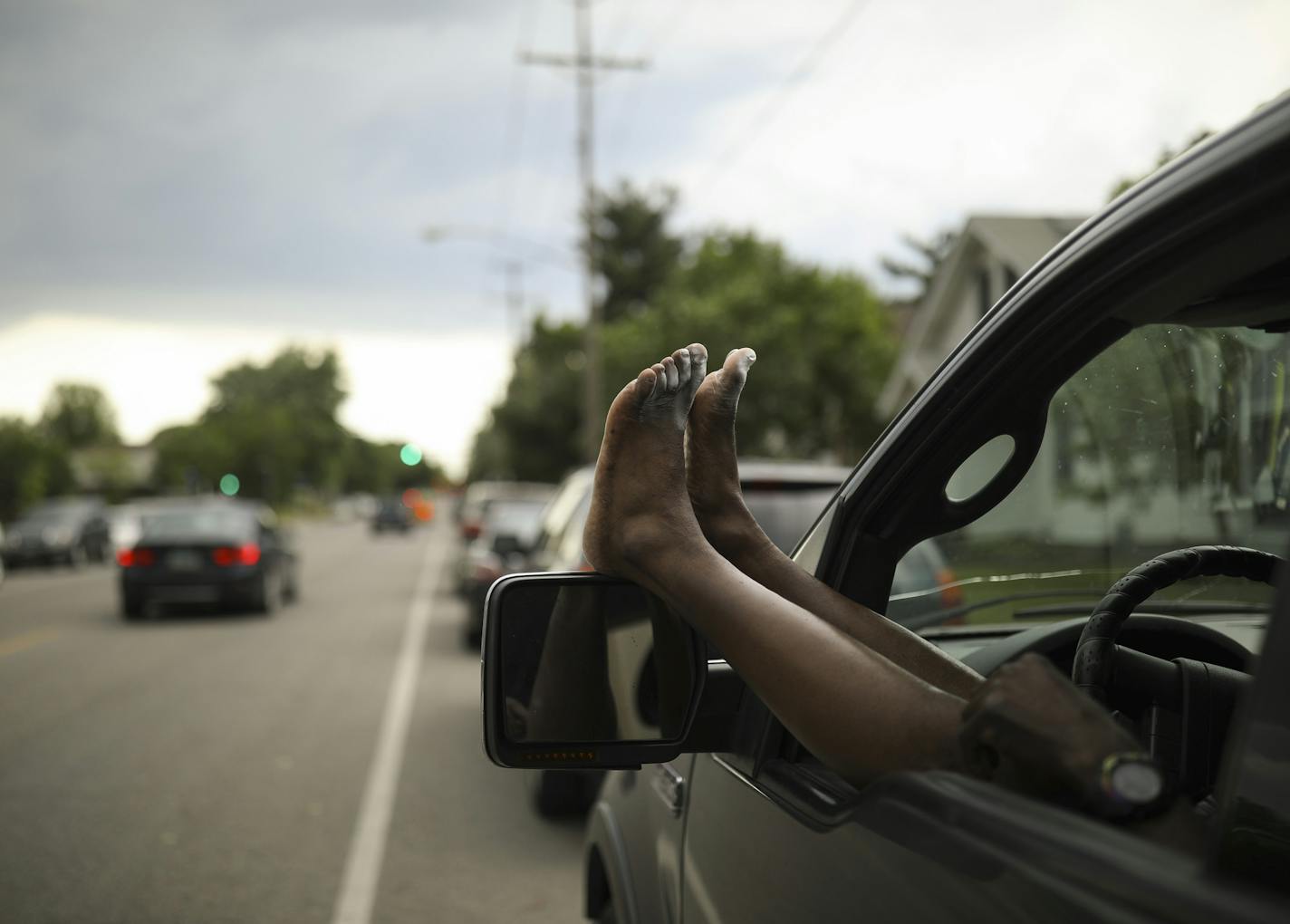 Charlie Ware rested his feet while sitting in his vehicle across from Lake Hiawatha Park on 28th Ave. S. in Minneapolis Monday afternoon. ] JEFF WHEELER &#xef; jeff.wheeler@startribune.com For only the second time in history, the thermometer reached 100 degrees in the month of May, among other records set Monday, Memorial Day, May 28, 2018. As the day wore on, rain threatened, but people continued to enjoy the day near Lake Hiawatha in Minneapolis.