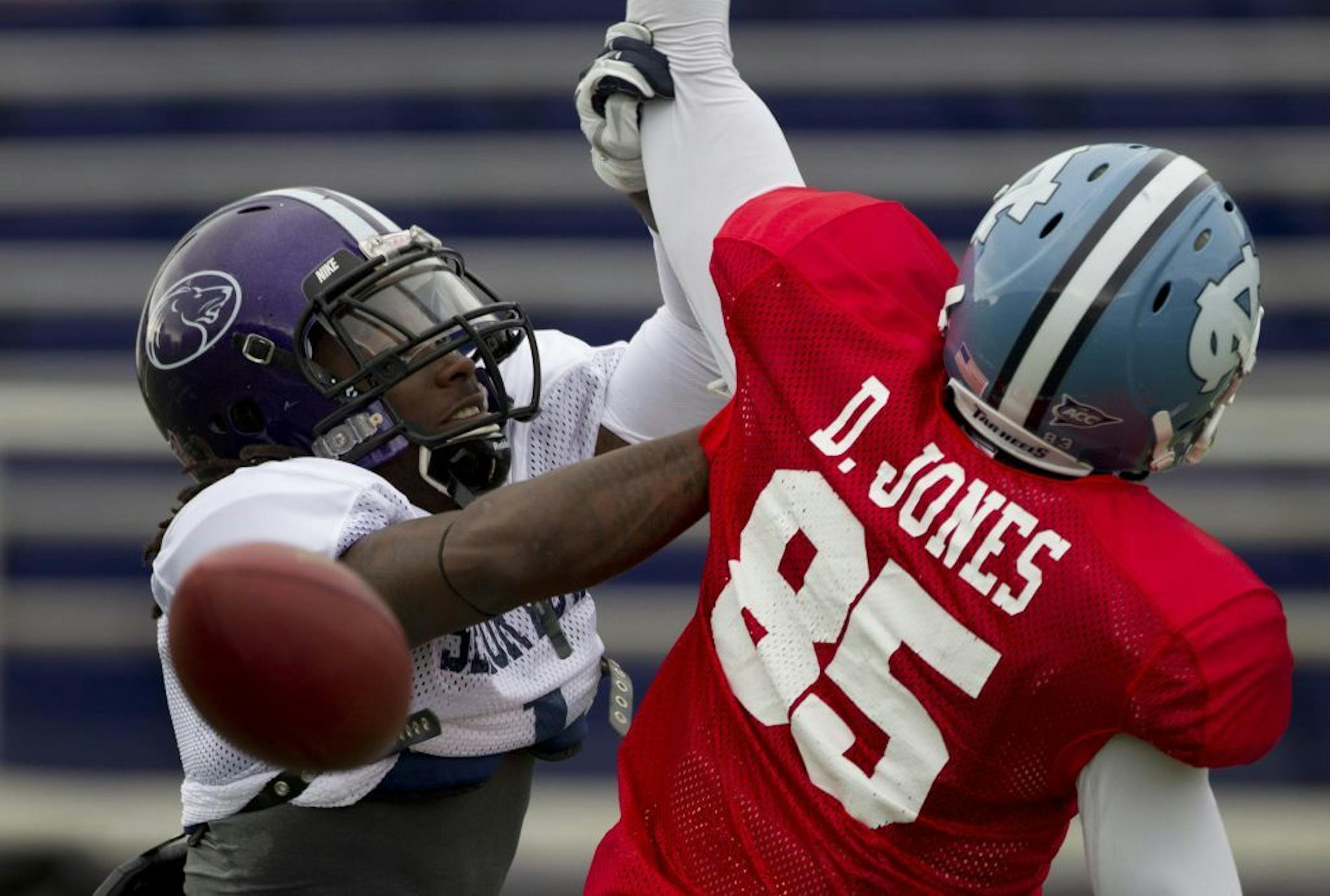 In this photo taken Jan. 25, 2012, South squad defensive back Janoris Jenkins, left, of North Alabama, breaks up a pass intended for wide receiver Dwight Jones (85), of North Carolina, during Senior Bowl South Squad NCAA college football practice at Ladd-Pebbles Stadium in Mobile, Ala.