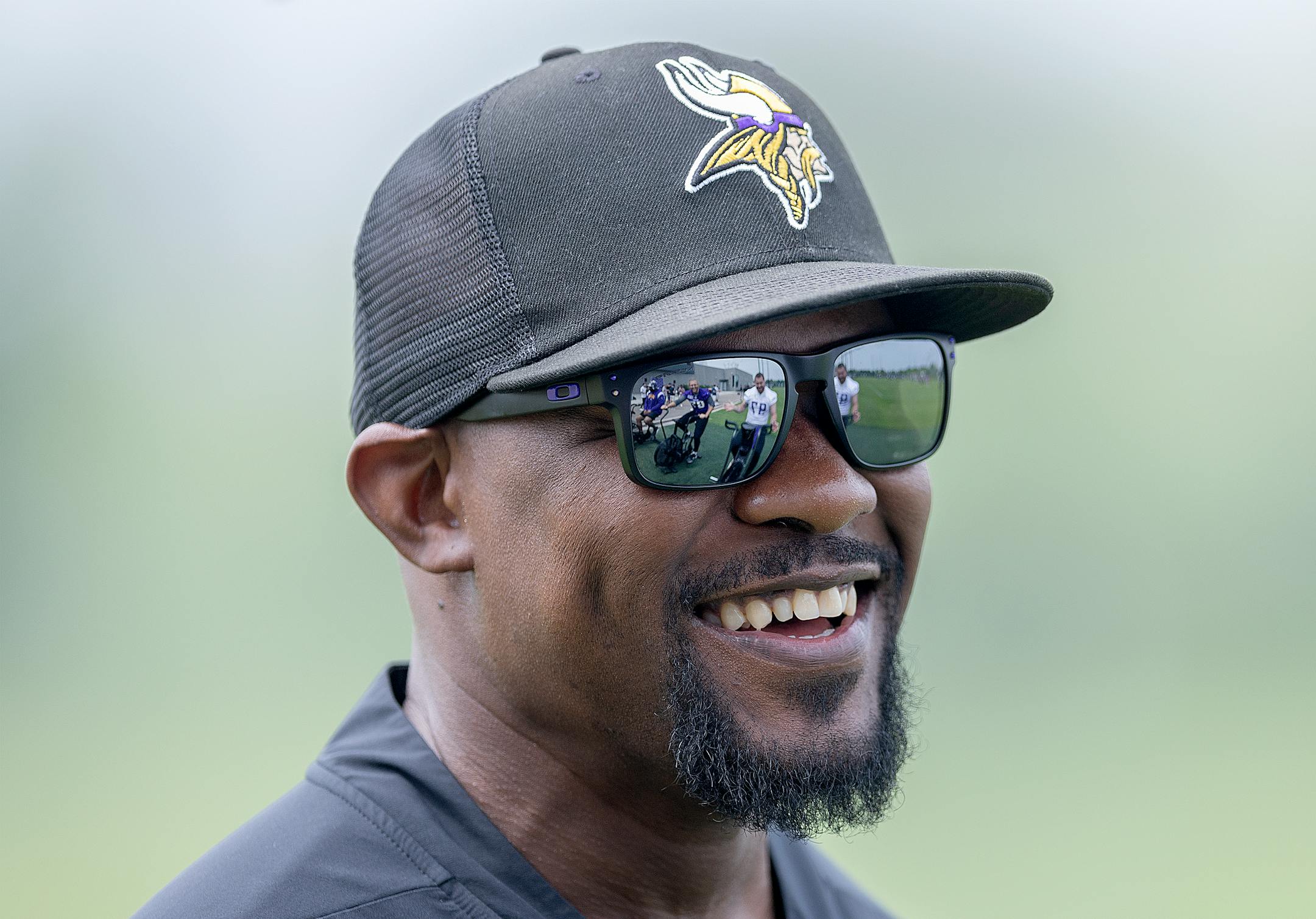 Vikings defensive coordinator Brian Flores chats with players on the bikes during practice at the TCO Performance Center in Eagan, Minn., on Tuesday, June 6, 2023.