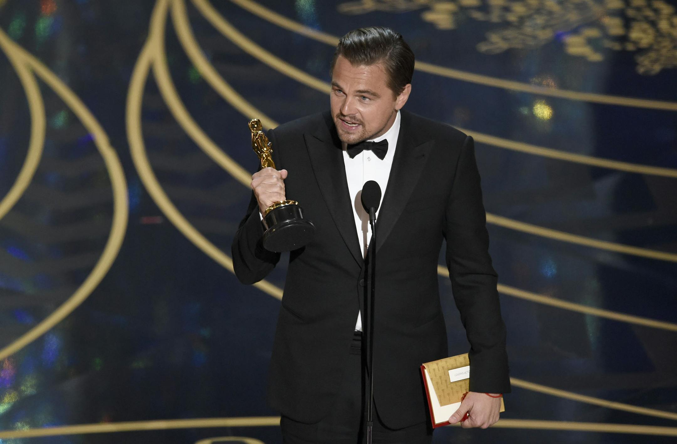 Leonardo DiCaprio accepts the award for best actor in a leading role for ìThe Revenantî at the Oscars on Sunday, Feb. 28, 2016, at the Dolby Theatre in Los Angeles. (Photo by Chris Pizzello/Invision/AP) ORG XMIT: MIN2016022823073427
