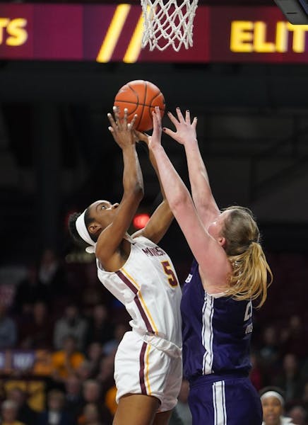Gophers Taiye Bello (5) goes up for a layup against Wildcats Abbie Wolf