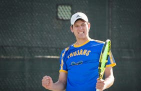 Collin Beduhn of Wayzata reacts after winning a point against Matthew Fullerton of Edina, at the Creek Valley Elementary School courts in Edina, Minn.