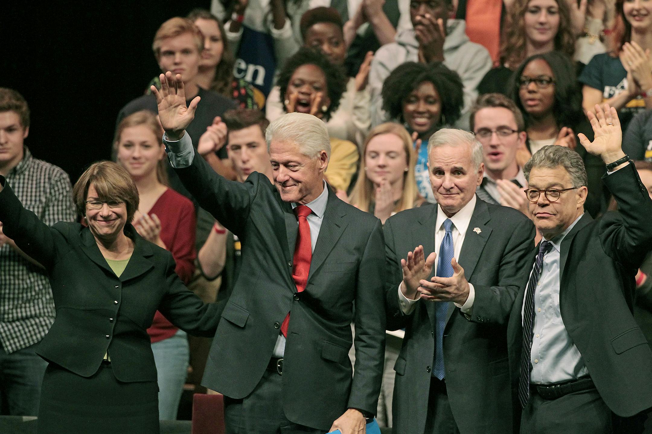 Senator Amy Klobuchar, left, President Bill Clinton, Governor Mark Dayton, and Senator Al Franken waved to the crowd of the President headlined a grassroots early vote and government event hosted by the University of Minnesota College Democrats in support of Senator Al Franken and Governor Mark Dayton at Northrop University, Friday, October 10, 2014 in Minneapolis, MN. ] (ELIZABETH FLORES/STAR TRIBUNE) ELIZABETH FLORES • eflores@startribune.com