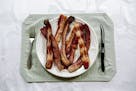 FILE-- A plate of bacon in New Orleans, July 28, 2016. A recent report from the Department of Agriculture, boosted by the Ohio Pork Council, reported 