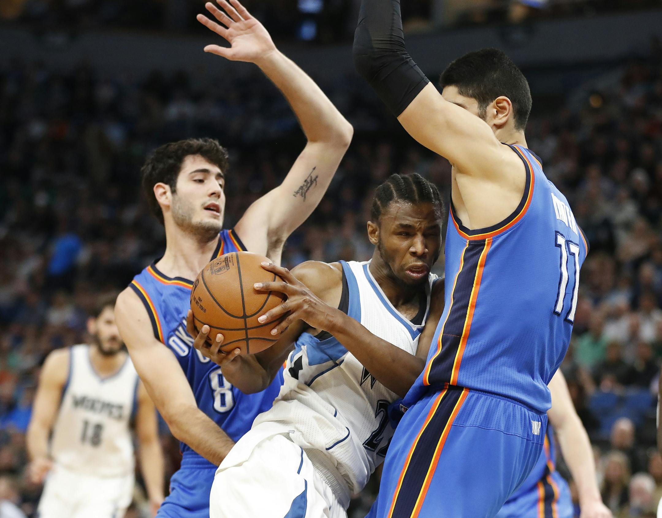 Minnesota Timberwolves forward Andrew Wiggins (22) was stopped by Oklahoma City Thunder center Enes Kanter (11) as he tried to drive the lane at Target Center Tuesday April 11, 2017 in Minneapolis ,MN.] JERRY HOLT ï jerry.holt@startribune.com