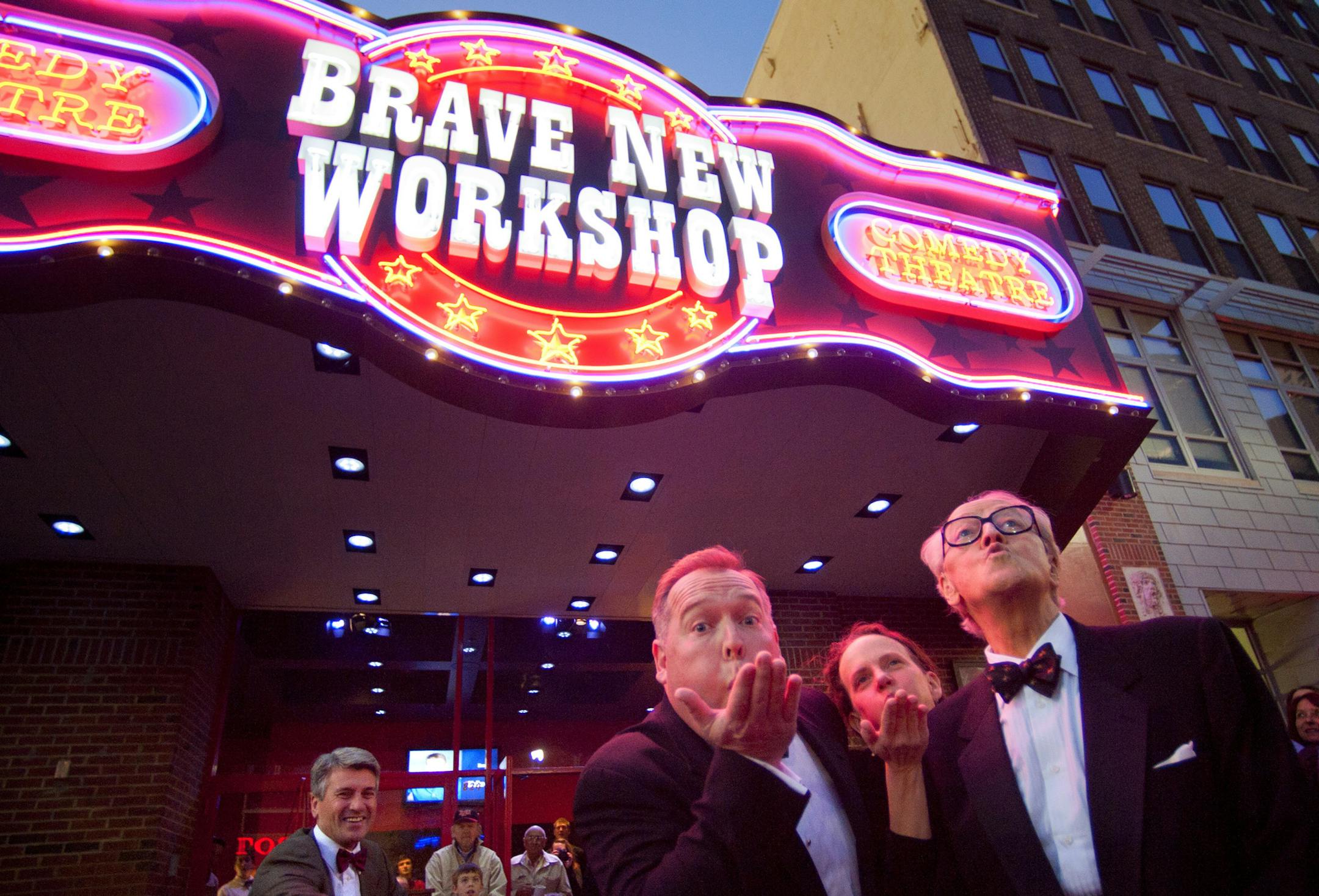 While Mayor R.T. Rybak peddled fast on a stationary bicycle to "power up the lights" Brave New Workshop owners John Sweeney and Jenni Lilledahl along with founder Dudley Riggs, blew the lights on during the opening night marquee lighting ceremony. The Theater commemorated its move from Uptown to new location on Hennepin Ave with an opening night marquee-lighting ceremony. ] GLEN STUBBE * gstubbe@startribune.com ORG XMIT: MIN2014082014512046 ORG XMIT: MIN1408201455067874